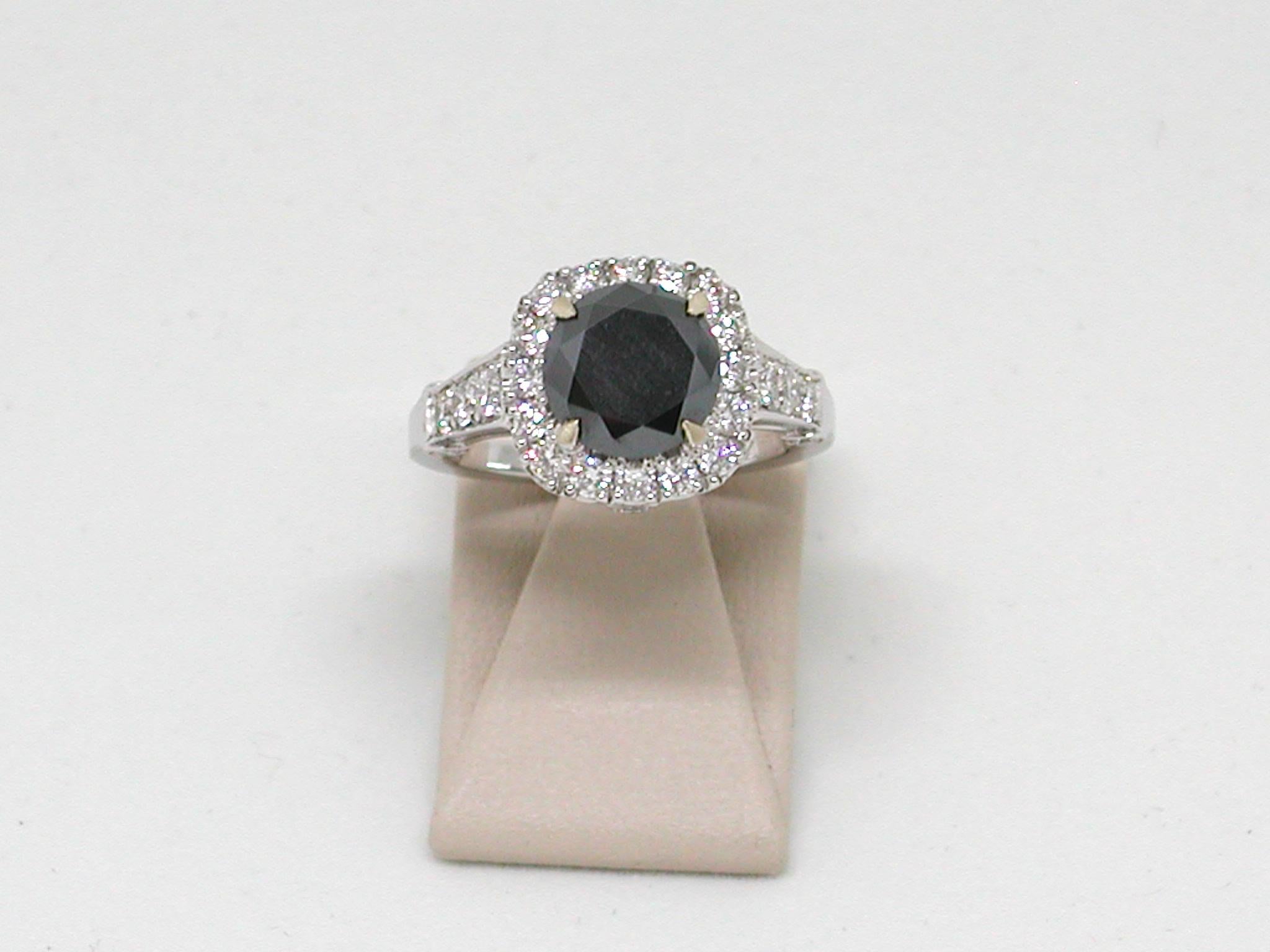 Gold: 18 kt yellow gold 
Weight: 6.95 g 
Black Diamond: 2.50 ct. Natural Fancy Black
White Diamonds: 0.90 ct. F / VS1
Width: 1.20 cm 
Ring size: adjustable up to size 70, free of charge 
All our jewellery comes with a certificate appraisal and 5