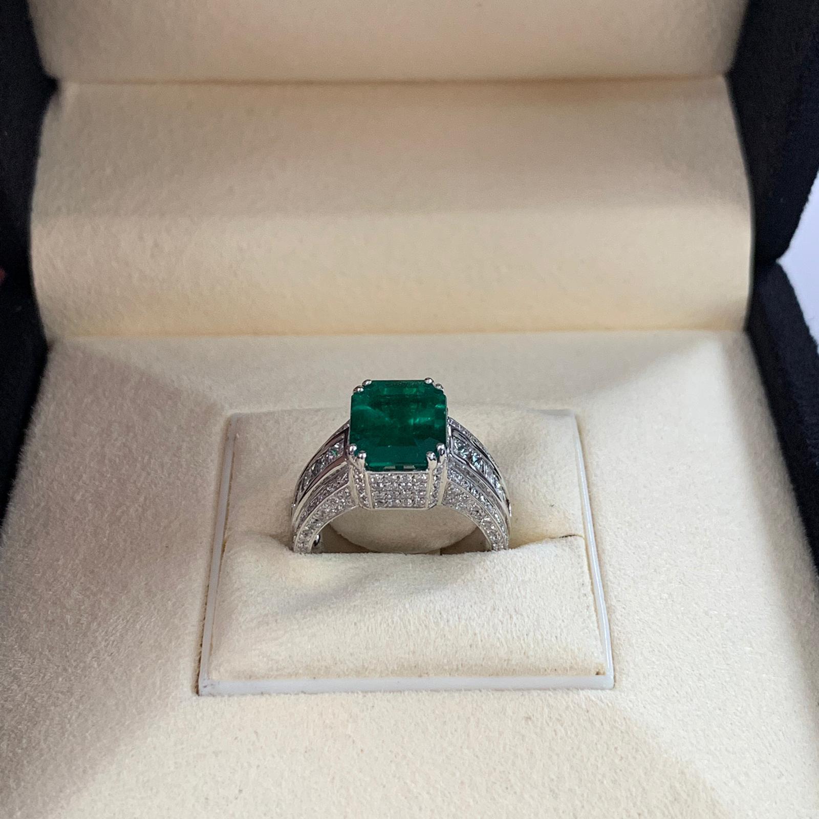 Beautiful 3.40 carats of Colombian Emerald, white diamond band total weight 2.01 carats. Set on 4 prong 18k white gold. 