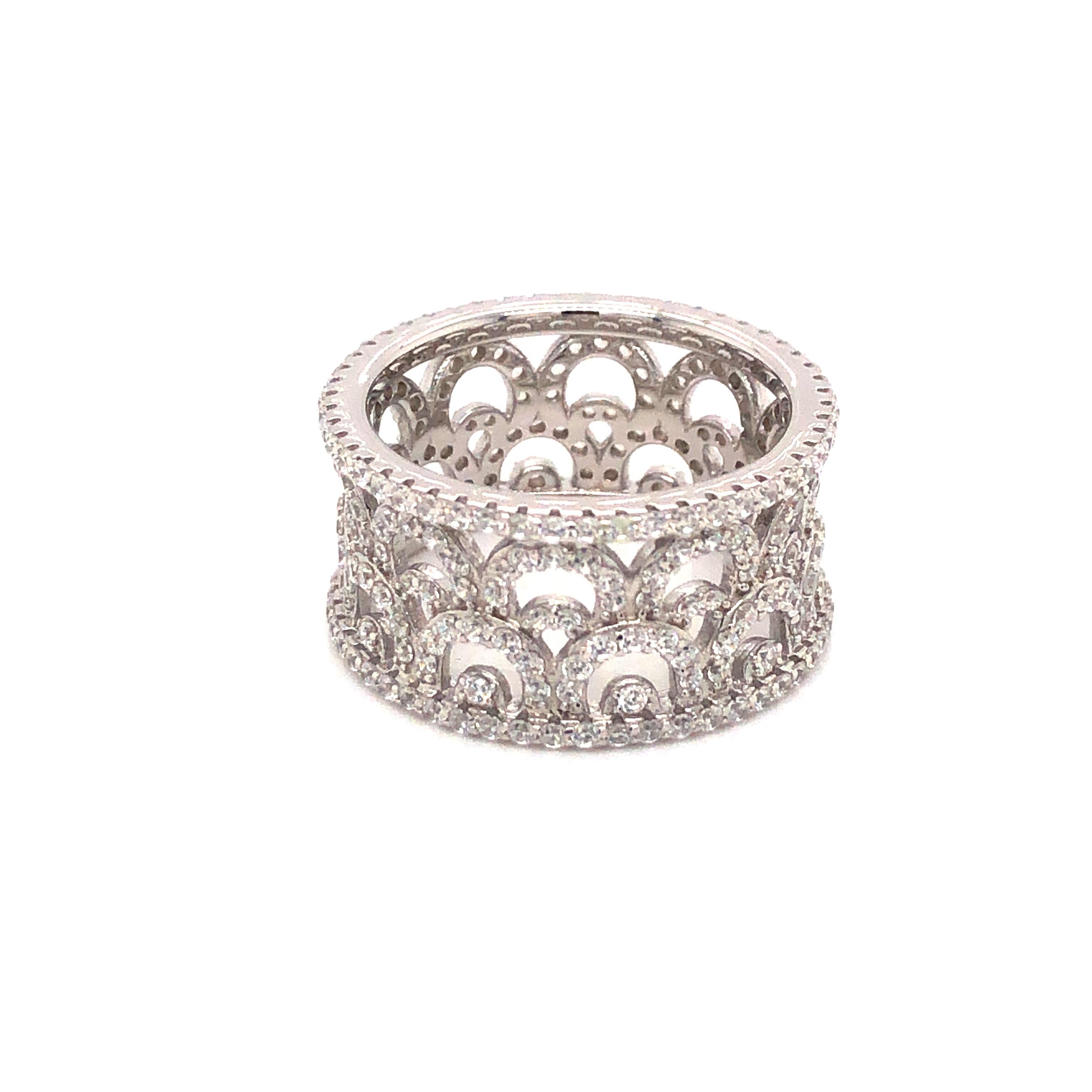 This intricately detailed women's wide eternity band features 3.40ct of round brilliant cut cubic zirconia.
The fashionably wide vintage design is set in 925 sterling silver and finished in either a high gloss white rhodium or 14kt rose gold or 14kt