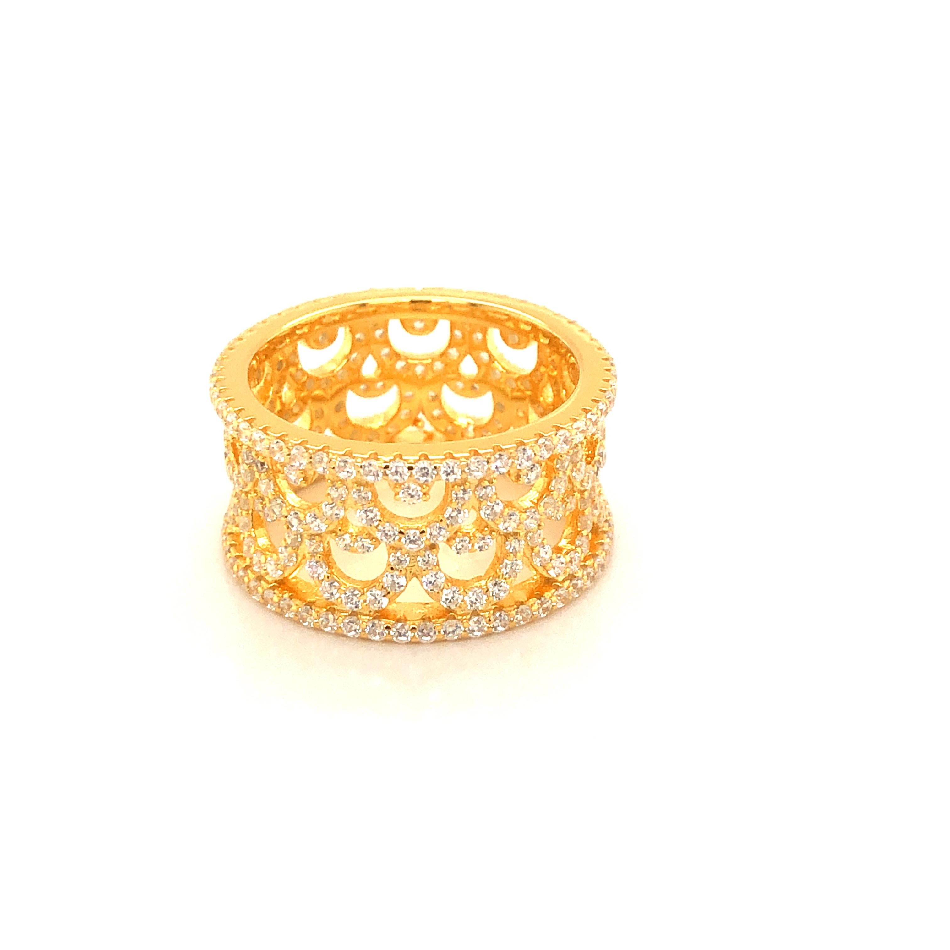 This intricately detailed women's wide eternity band features 3.40ct of round brilliant cut cubic zirconia.
The fashionably wide vintage design is set in 925 sterling silver and finished in either 14kt yellow gold, 14kt rose gold or high gloss white