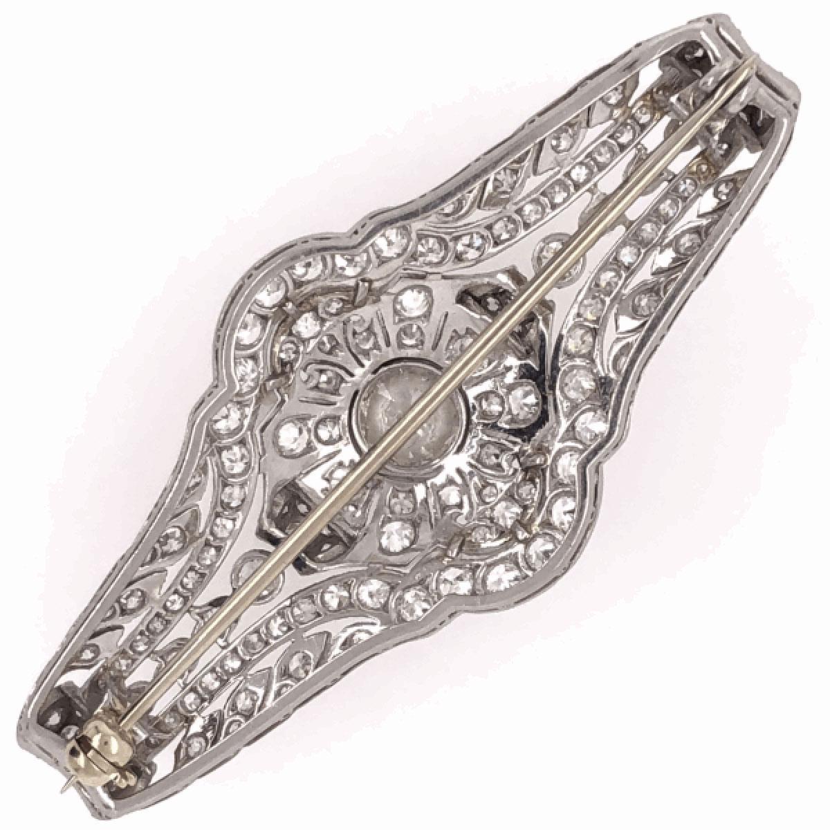 Simply Beautiful! Elegant and finely detailed Art Deco Diamond Platinum Brooch Pin.  Handmade Filigree and Milgrain, set with Old European cut Diamonds approx. 0.75 total Carat weight and side Diamonds approx. 3.40 total Carat weight. The Brooch is