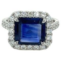 3.40 Carat Emerald Cut Ceylon Sapphire 
Diamond Halo Ring in 18karat White Gold