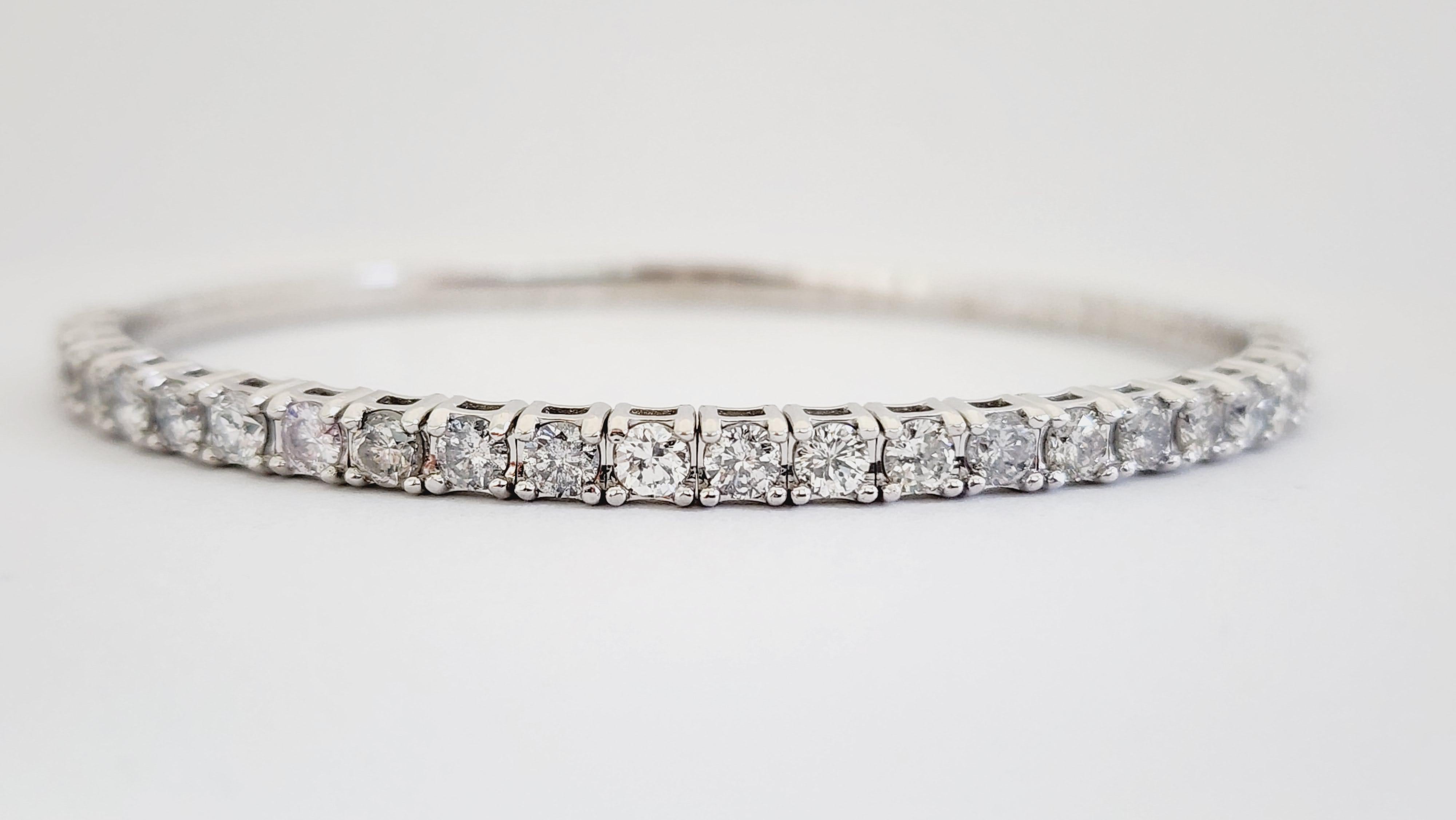 Natural Diamonds 3.40 ctw flexible half way around bangle white gold 14k 7 Inch. 
Average Color F Clarity I, 3.9 mm wide.