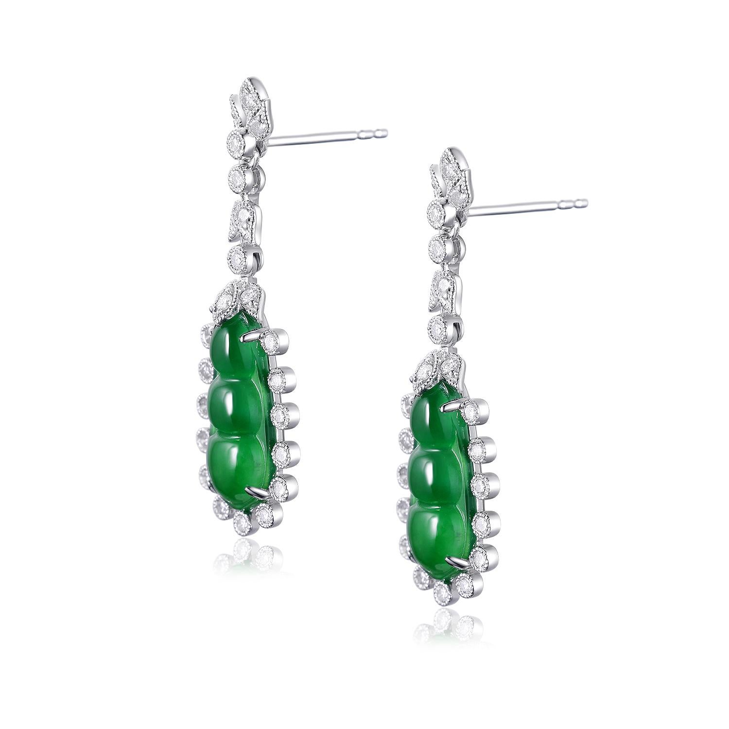 These exquisite earrings are a perfect blend of luxury and sophistication, featuring a captivating design that highlights the beauty of their gemstones. Each earring showcases a vibrant 3.40-carat jade stone, intricately carved and polished to