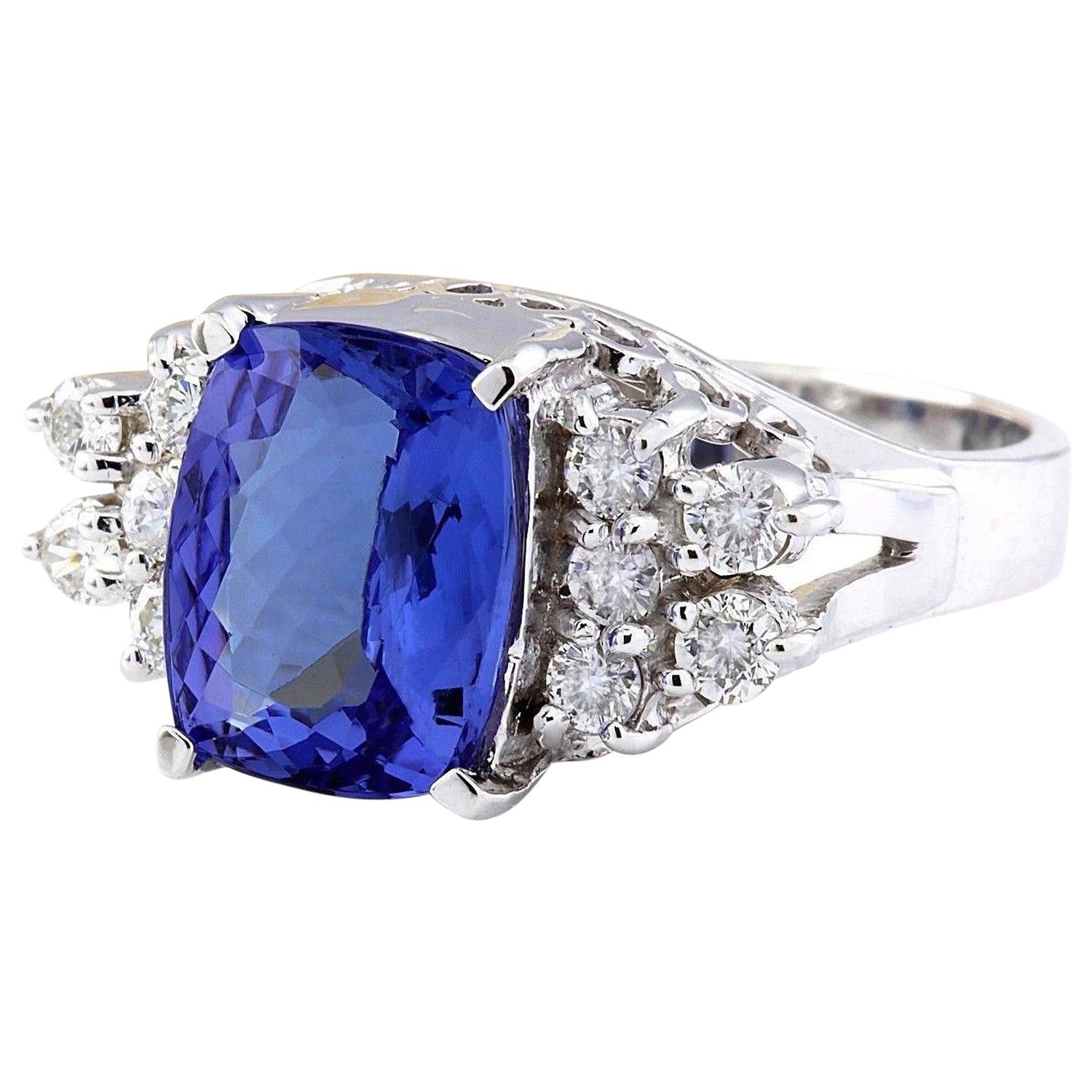 Indulge in the elegance of this 14K solid white gold diamond ring, featuring a genuine tanzanite gemstone weighing 3.05 carats. The cushion-cut stone, measuring 10.00x8.00 mm, exudes a captivating allure. Surrounding the tanzanite are sparkling