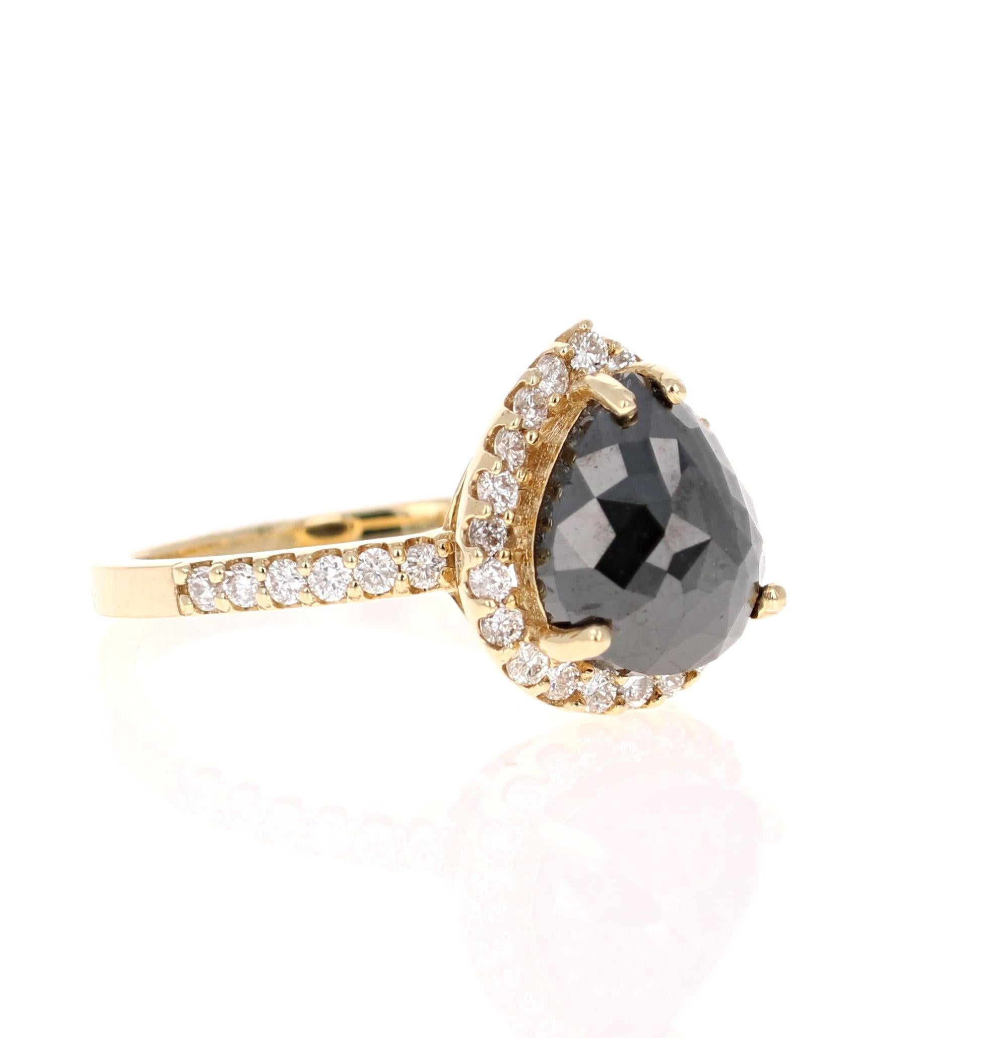 pear cut black diamond engagement ring