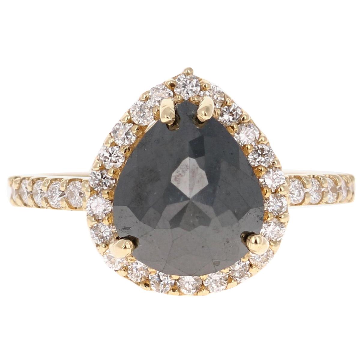 Gorgeous Black Diamond ring that can transform into an Engagement ring!! 

There is a 2.90 Carat Pear Cut Black Diamond in the center on the ring which is surrounded by a Halo of  34 White Round Cut Diamonds that weigh 0.50 Carats (Clarity: SI,