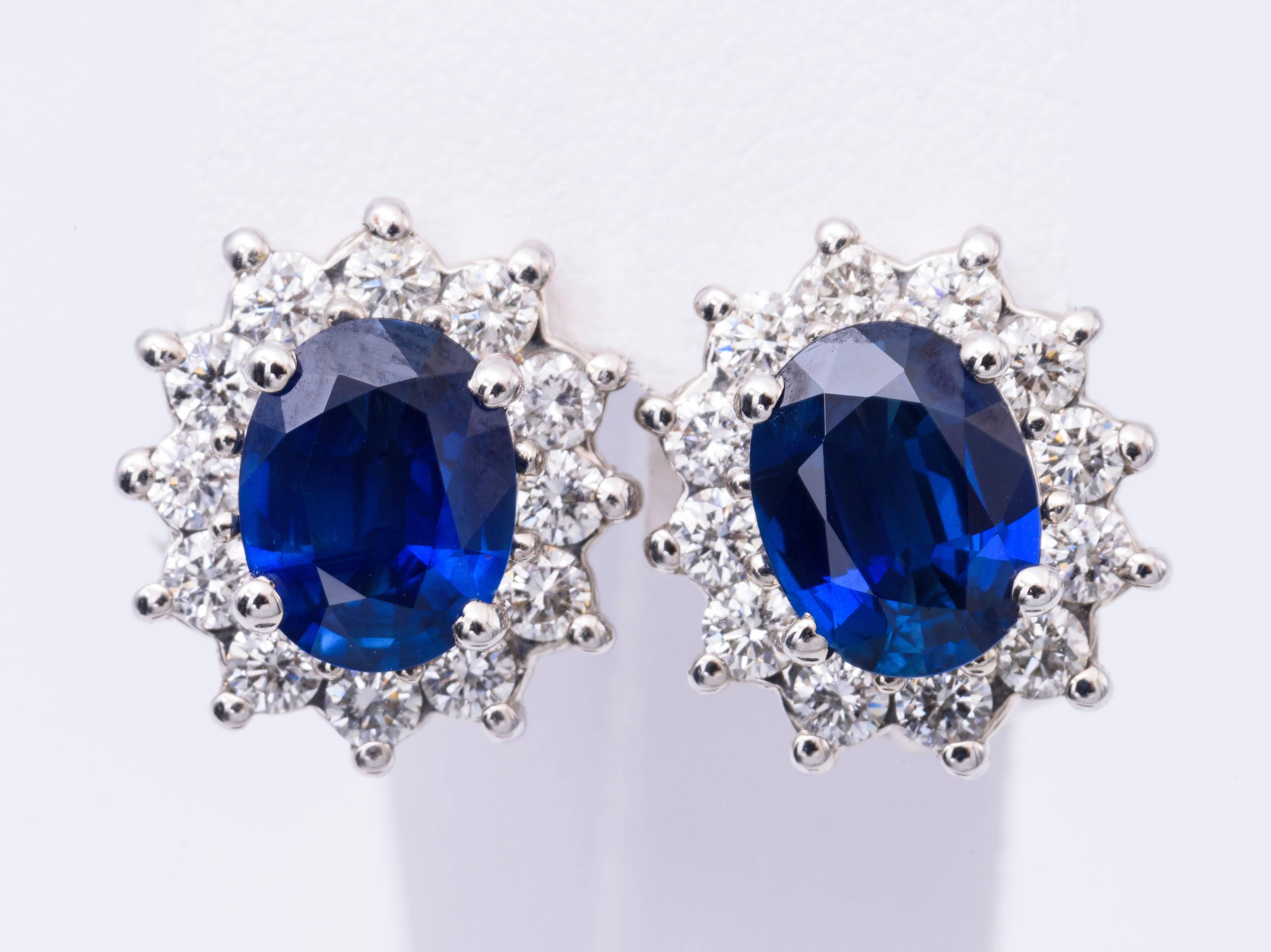 The oval sapphire in these earrings have a total carat weight of 3.40 carats, and they measure 8x6 MM.. The diamonds have a total carat weight of 0.94 carats.
The diamonds are H color and clarity is SI2.
The sapphire is  very bright and nice.
The