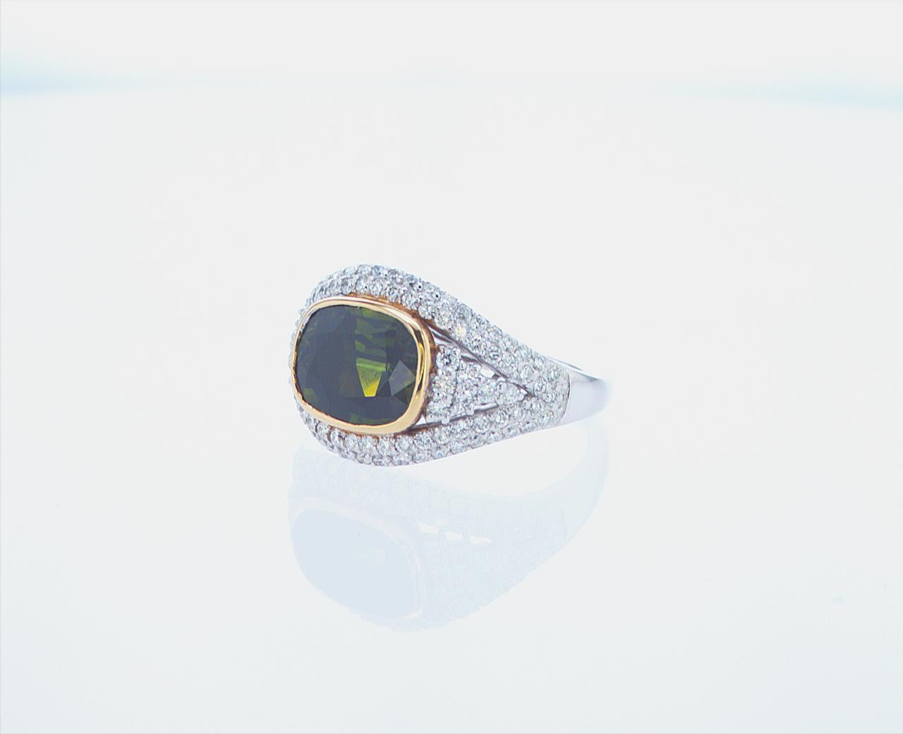 3.40ct Green Sapphire with 0.84ct Total Weight of G/H Color VS Clarity Diamonds.

