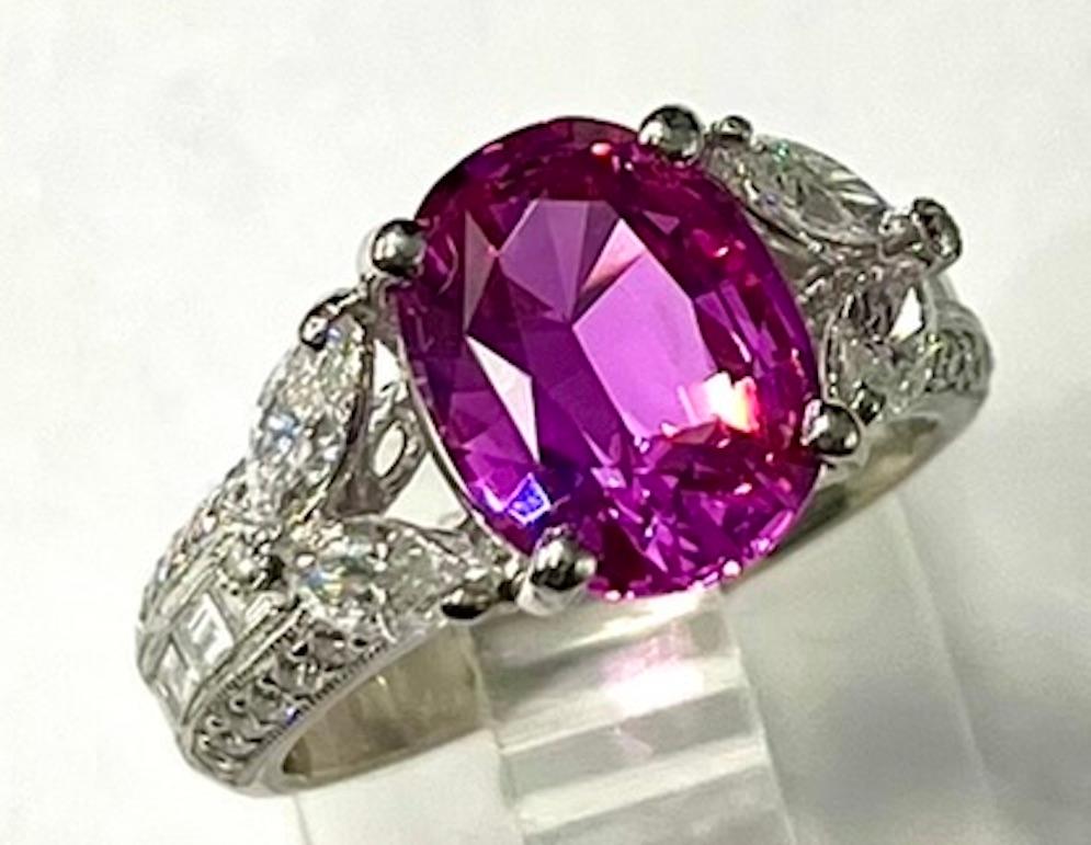 This ring features a beautifully cut Oval Shape 3.40Ct Pure Pink Sapphire. The pink color appears rich and translucent and the stone is practically flawless. The design of the ring is elegant with a modern yet old world feel. Pink Sapphires without