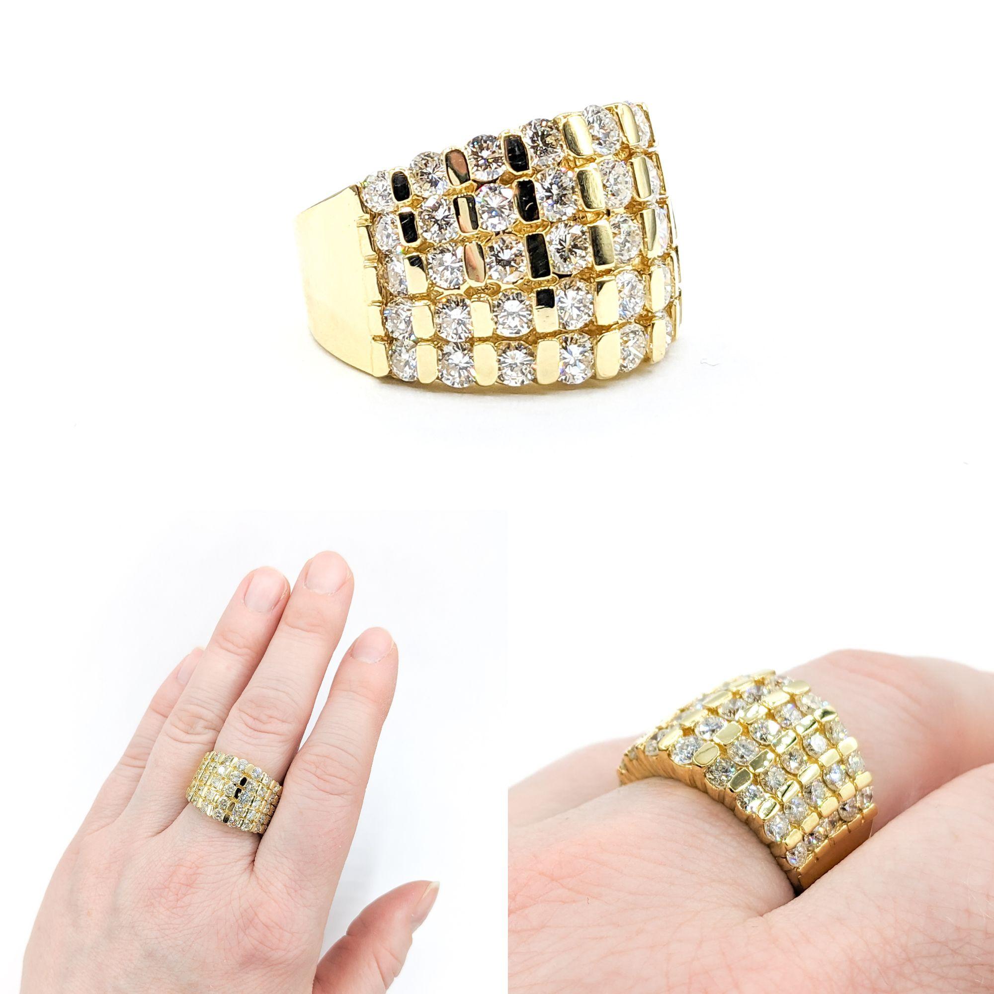3.40ctw Diamond 9-Row Ring In Yellow Gold

This stunning Diamond Fashion Ring, meticulously crafted in 14kt yellow gold, boasts an impressive 3.40ctw of diamonds set in a 9-row bar arrangement. These diamonds, of SI clarity and a near colorless