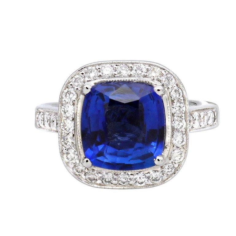                                Gorgeous diamond and sapphire classic ring .
The center contains 3.41 carat loyal blue cushion shape sapphire.
The natural sapphire is mounted in a platinum setting,surrounded by diamonds.
Sides and the halo contain