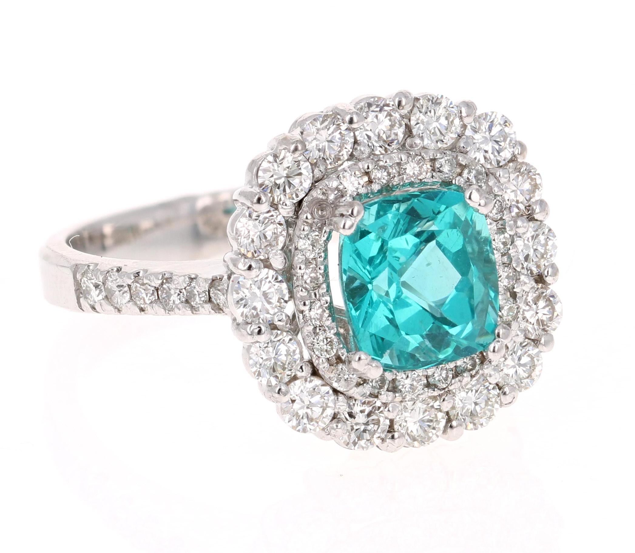 Gorgeous Double Halo Apatite and Diamond Ring.  
This ring has a 2.34 carat Cushion Cut Apatite in the center of the ring and is surrounded by a double halo of 48 Round Cut Diamonds that weigh 1.17 carat (Clarity: VS2, Color: H).  The total carat