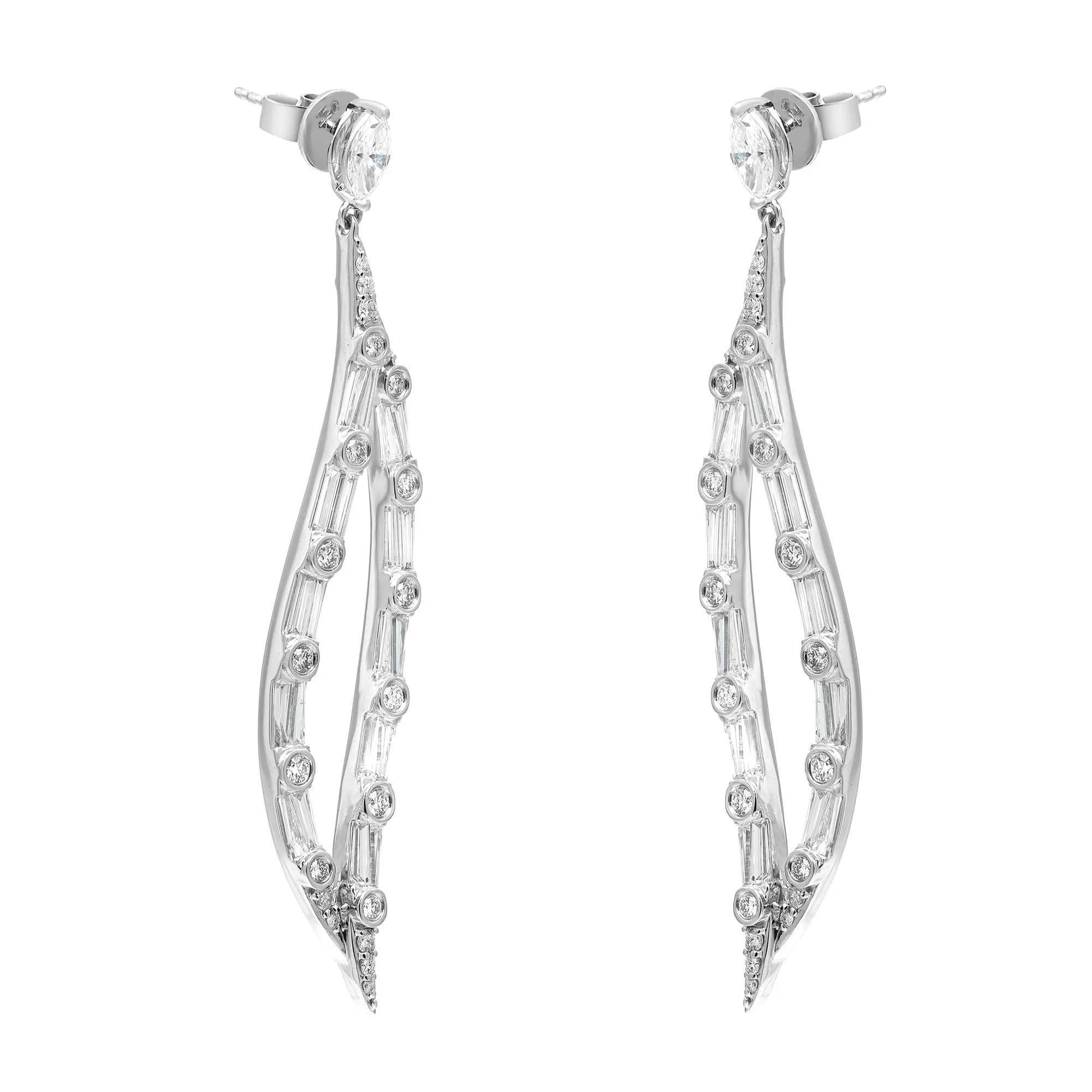 Elevate your style with these enchanting 3.41 Carat Marquise Baguette and Round Cut Diamond Drop Earrings. Impeccably crafted in 18K White Gold, their leaf-shaped design exudes nature-inspired grace. The 3.41 carats of marquise, baguette, and