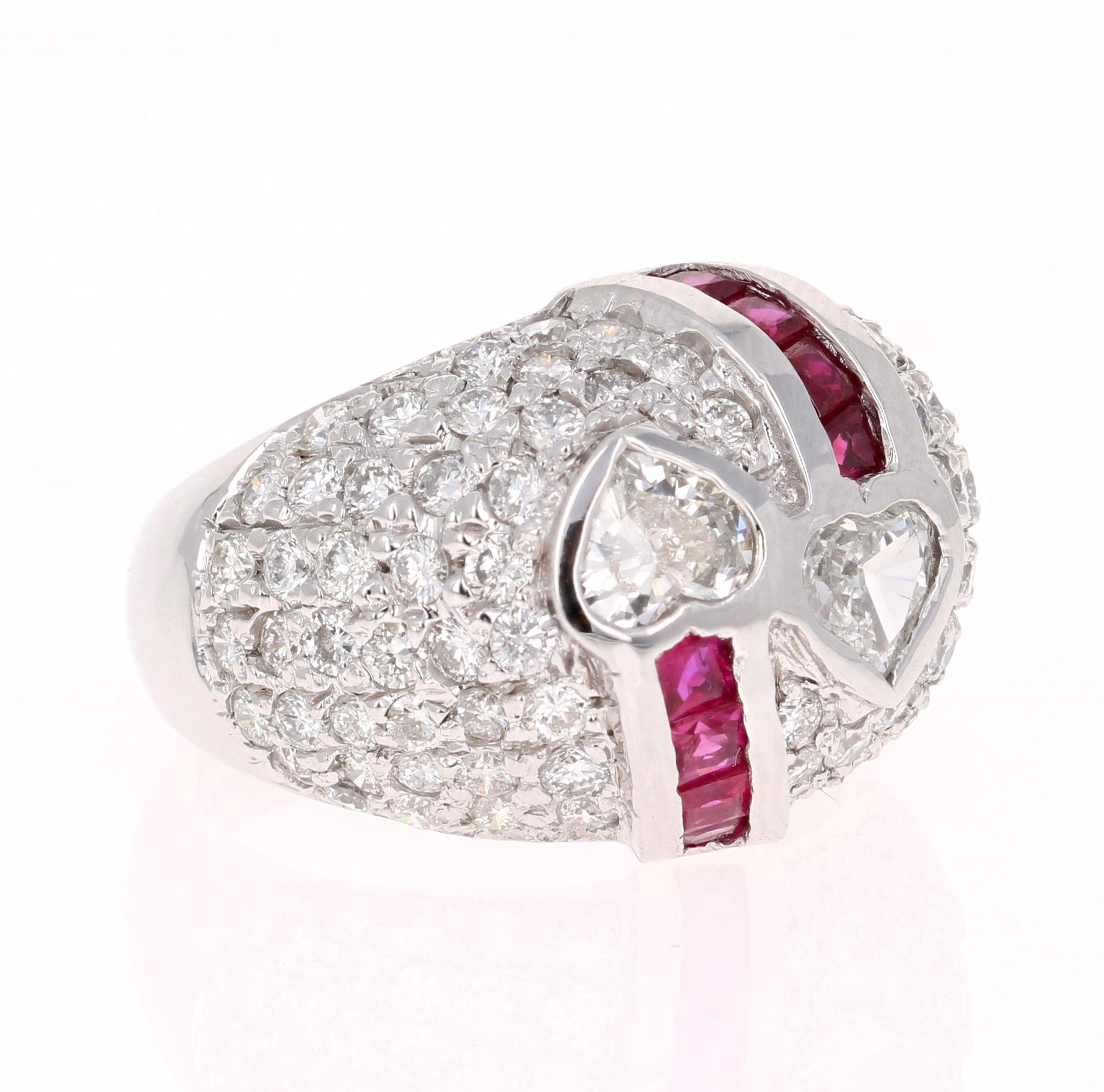 The ring has 2 Heart Cut Diamonds that weigh 0.72 carats and 86 Round Cut Diamonds that weigh 2.03 carats. The clarity and color of the diamonds are SI/F. There are 8 Rubies that weigh 0.66 carats. 

The ring is beautifully casted in 14K White Gold