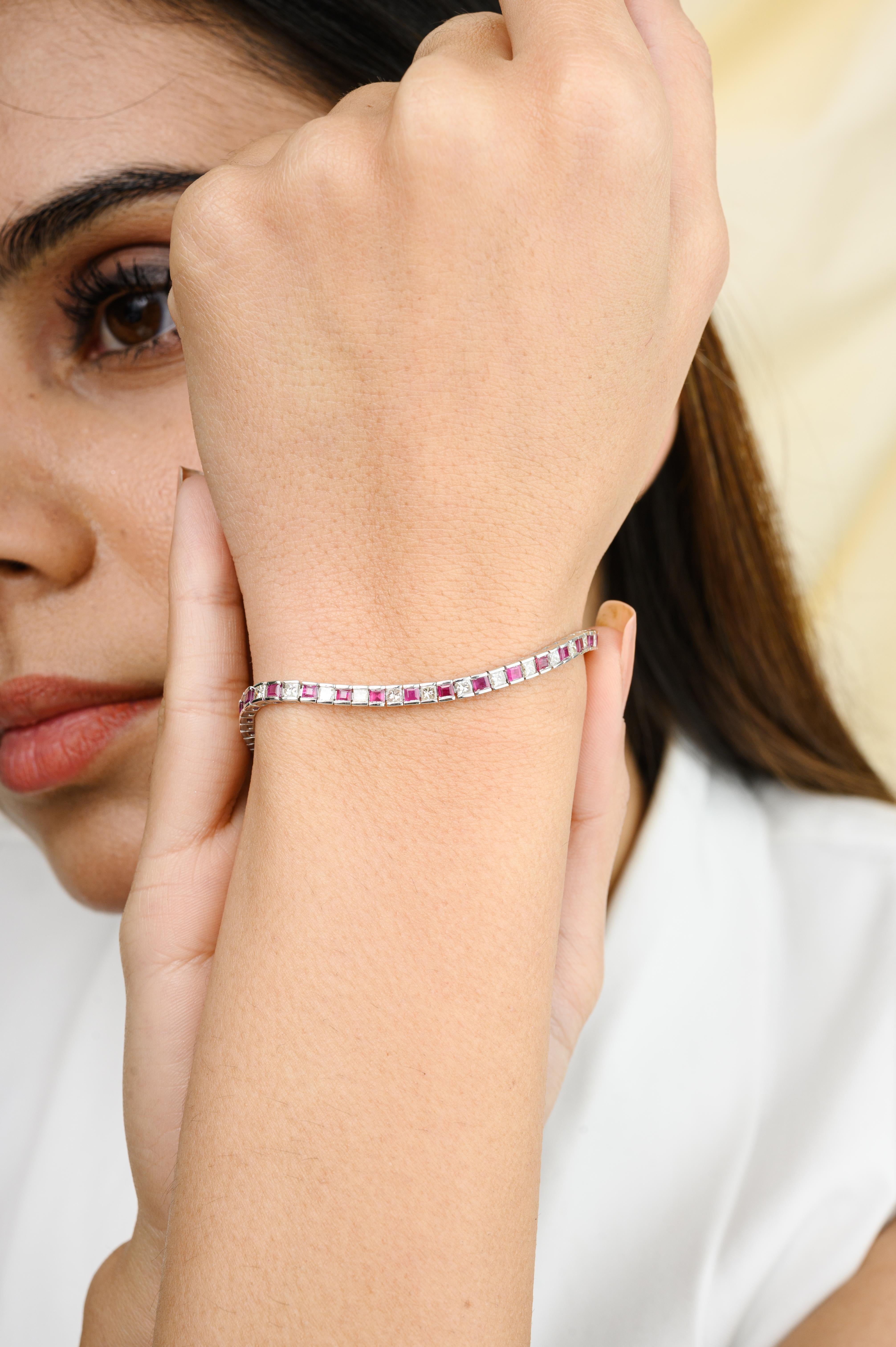 This Alternating Ruby Diamond Tennis Bracelet in 18K gold showcases 3.41 carats endlessly sparkling natural ruby and 2.28 carats of diamonds. It measures 7.5 inches long in length. 
Ruby improves mental strength. 
Designed with perfect square cut