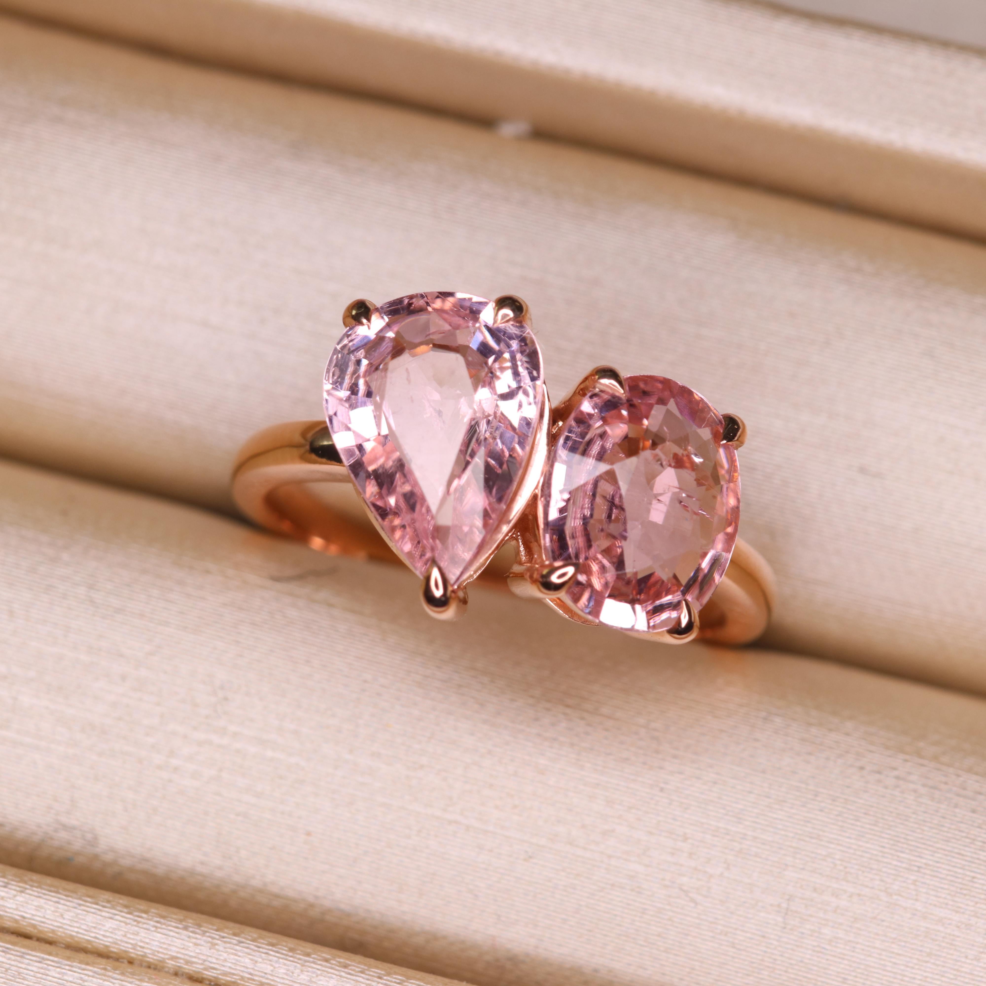 Step into the realm of the extraordinary with our one-of-a-kind tourmaline ring, a true testament to individuality and sophistication. This exceptional piece features not one, but two distinct pink tourmalines, each boasting its own unique shape -