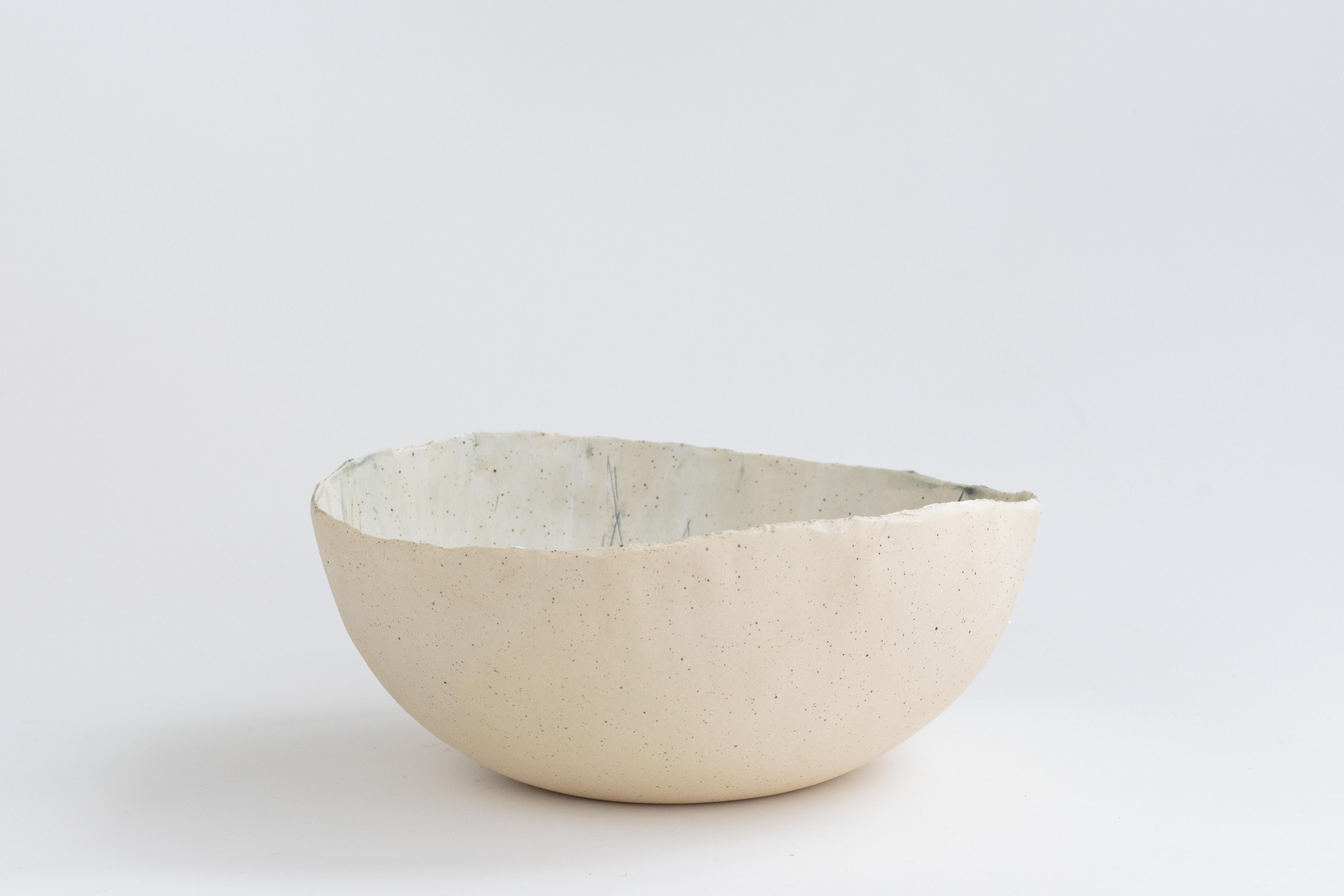 341 Hand Crafted Gathering Stoneware Bowl by Helen Prior

A delicate hand-crafted bowl, organic in shape with a torn clay edge in natural speckled stoneware clay.
Part of the Cross Pollination Series - the stylizing and abstraction of elements from