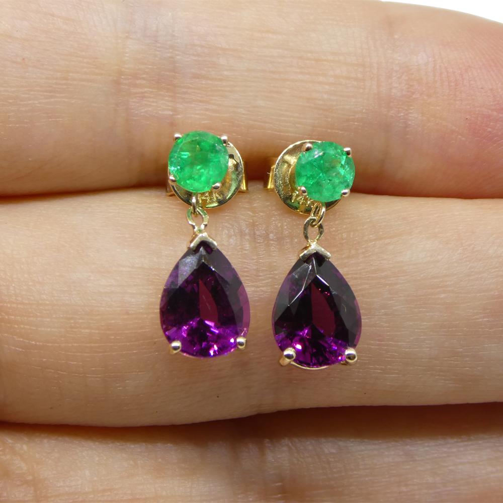 These two stunning purple garnets are set in a pair of 14k Yellow Gold earring settings with gorgeous Colombian emeralds.

These are made in Toronto, Canada, and are incredibly fine quality!


Description:

Gem Type: Garnet
Number of Stones: