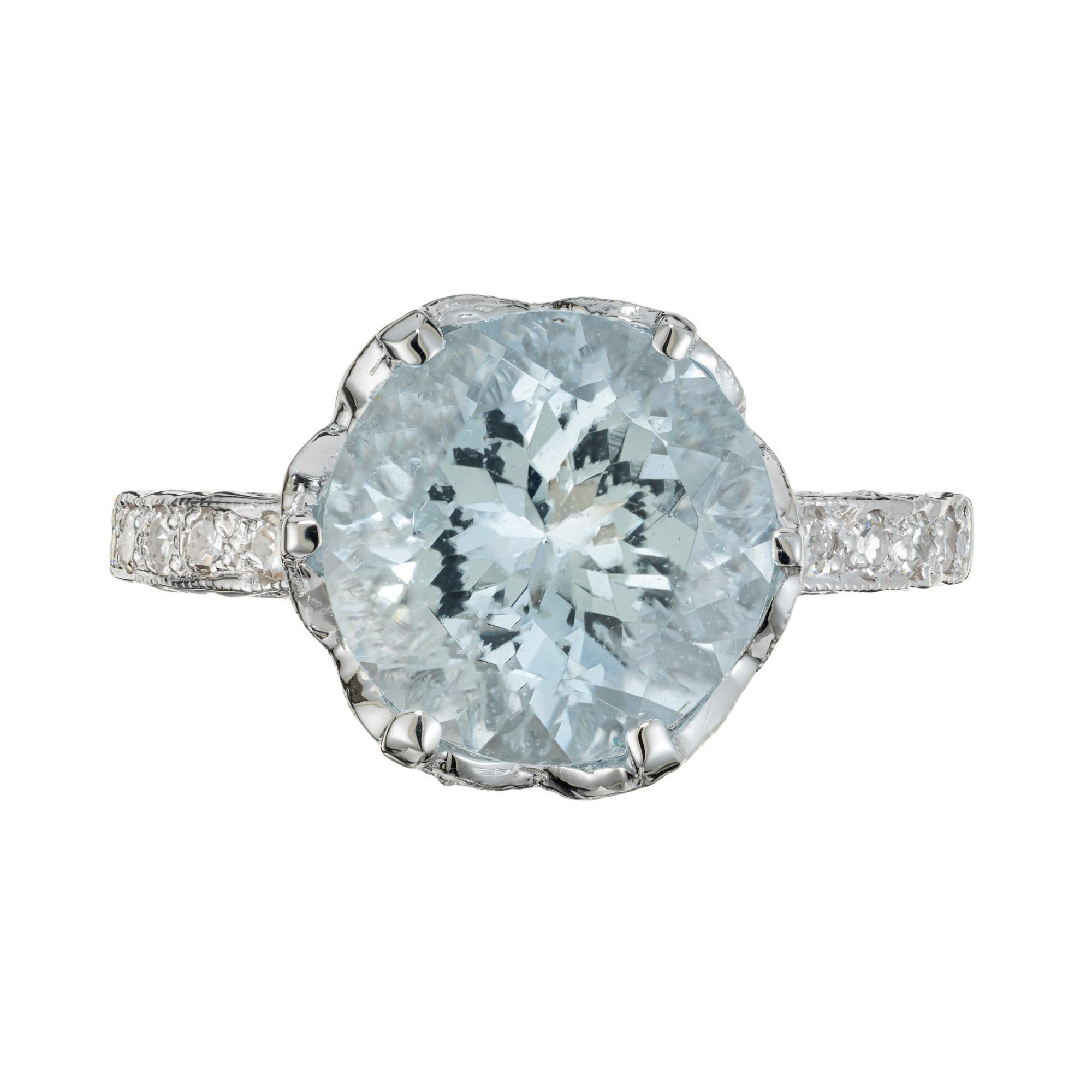 1930's Vintage Kings Crown design aquamarine and diamond ring. Round 3.42ct Aqua mounted in a platinum six prong setting with 32 accent diamonds around the crown and both shoulders of the shank. The crown sits high off the finger and has beautifully