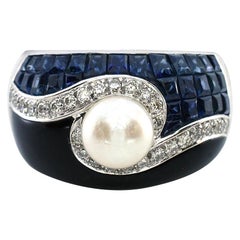 3.42 Carat Blue Sapphire Ring with Diamonds, Pearl, and Onyx