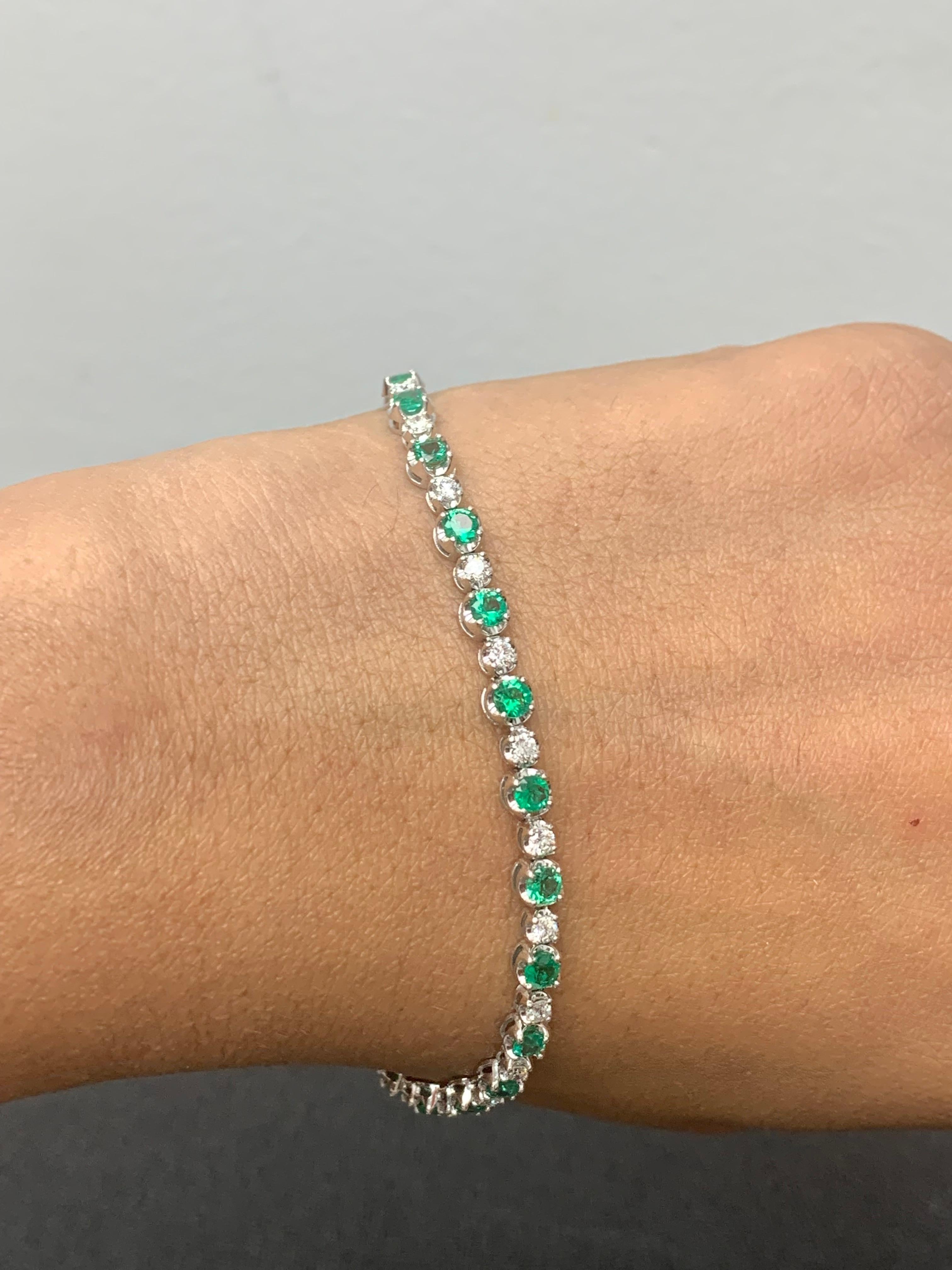 A stunning bracelet set with 23 Lush Green Emeralds weighing 3.42 carats total. Alternating these emeralds are 25 sparkling round diamonds weighing 1.15 carats in total. Set in polished 14k white gold. Double lock mechanism for maximum security. A
