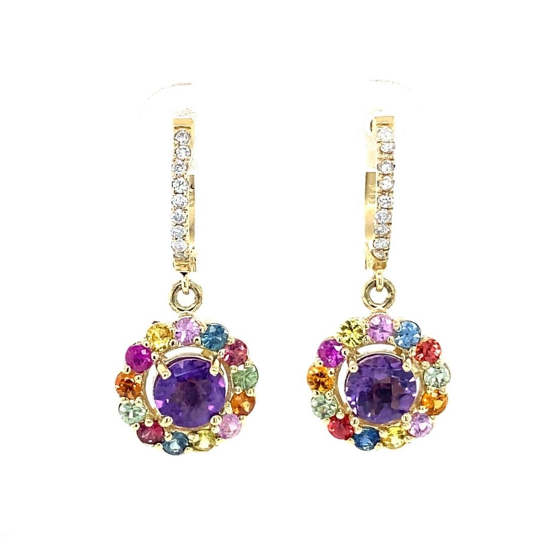 Amethyst, Multi-Color Sapphire and Diamond Drop Earrings! 

These cute and vibrant Earrings have 2 Round Cut Amethysts that weigh 1.61 Carats and are embellished with 26 Round Multi-Color Sapphires that weigh 1.65 Carats and 18 Round Cut Diamonds