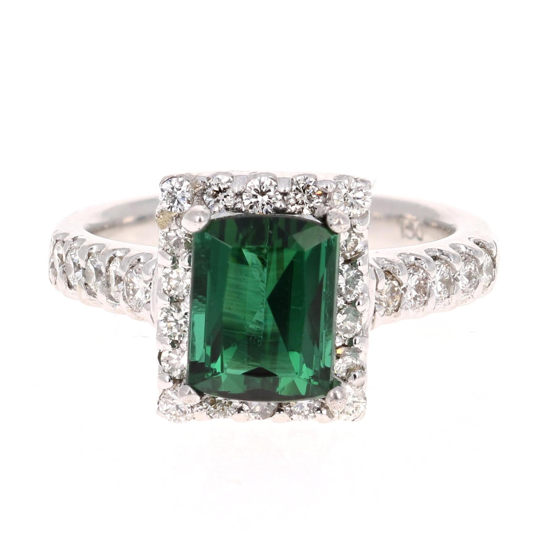 3.42 Carat Emerald Cut Green Tourmaline Diamond Cocktail Ring 

This gorgeous ring has a beautiful Emerald Cut Green Tourmaline weighing 2.69 Carats and 28 Round Cut Diamonds weighing 0.73 Carats.  The total carat weight of the ring is 3.42
