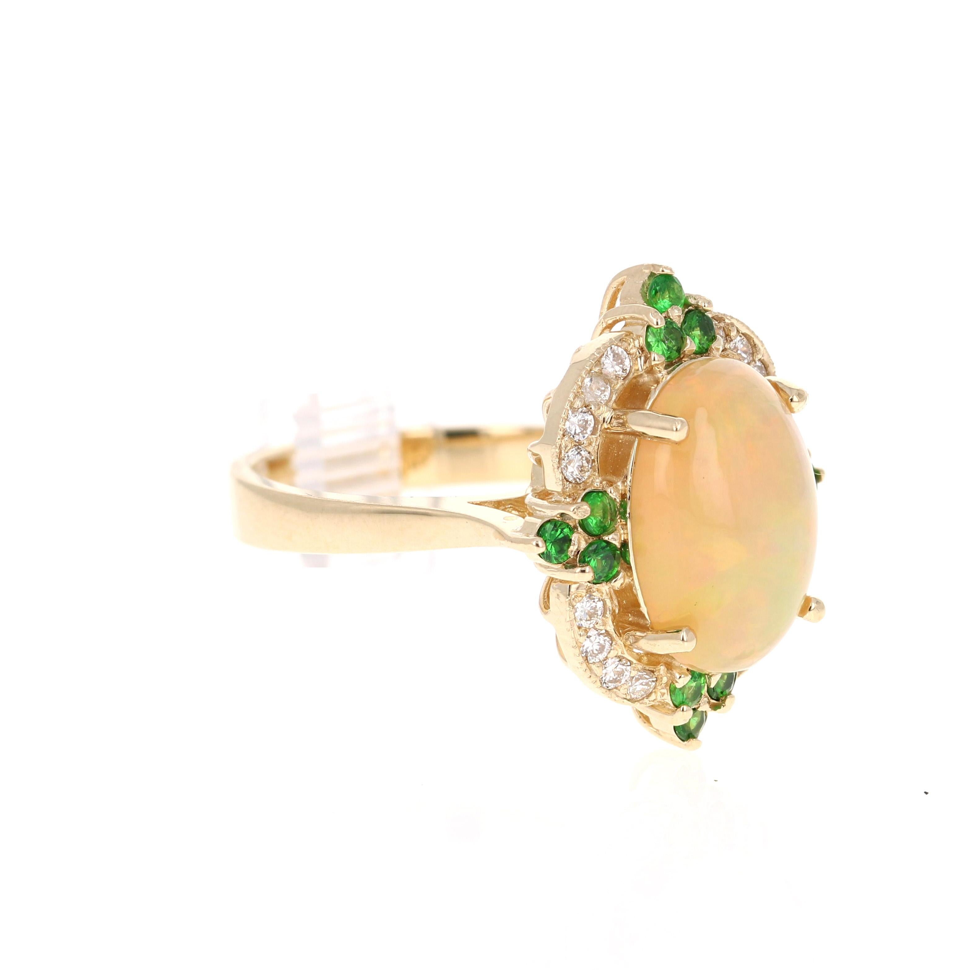 This gorgeous cocktail ring has a strinking Oval Cut Ethiopian Opal that weighs 2.78 Carats. The Opal measures approximately at 14 mm x 11 mm and has beautiful flashes of color in orange, green and yellow. 

The ring also has 12 Round Cut Tsavorites