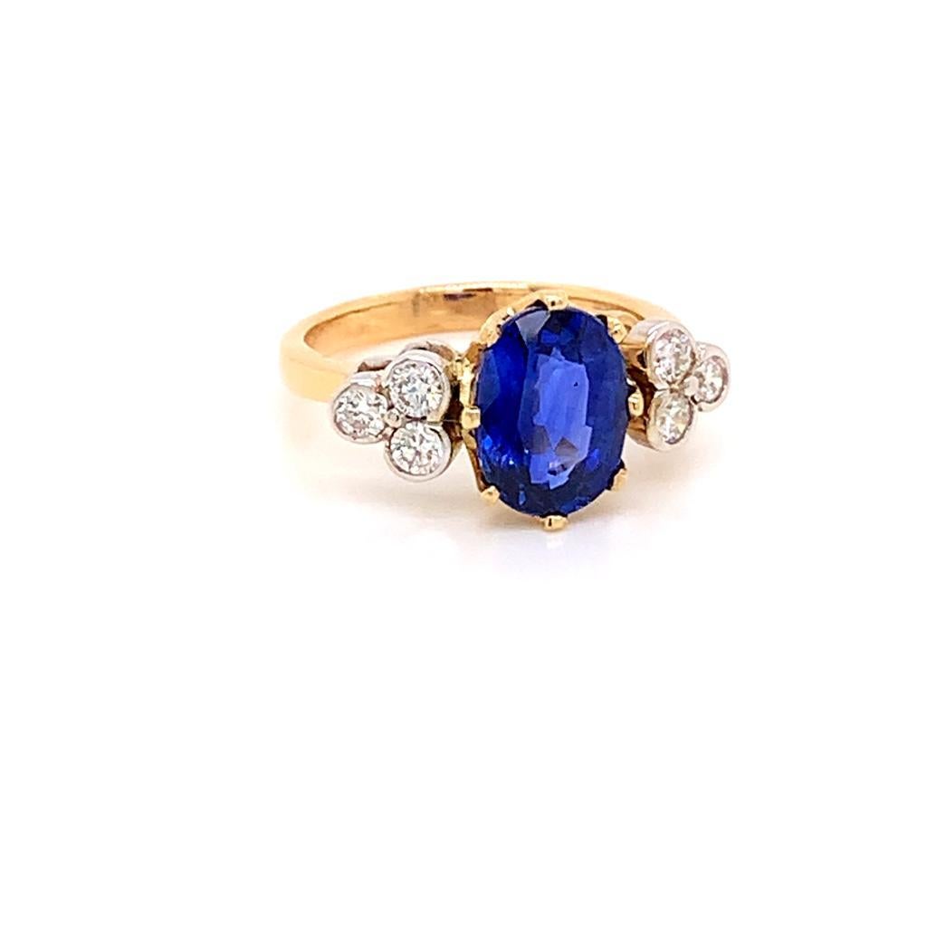 Oval Cut 3.42 Carat Oval Blue Sapphire and Diamond Ring in 18K Yellow Gold For Sale