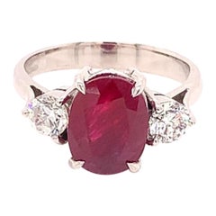 3.42 Carat Oval Cut Ruby and Diamond Three Stone Ring in 18K White Gold