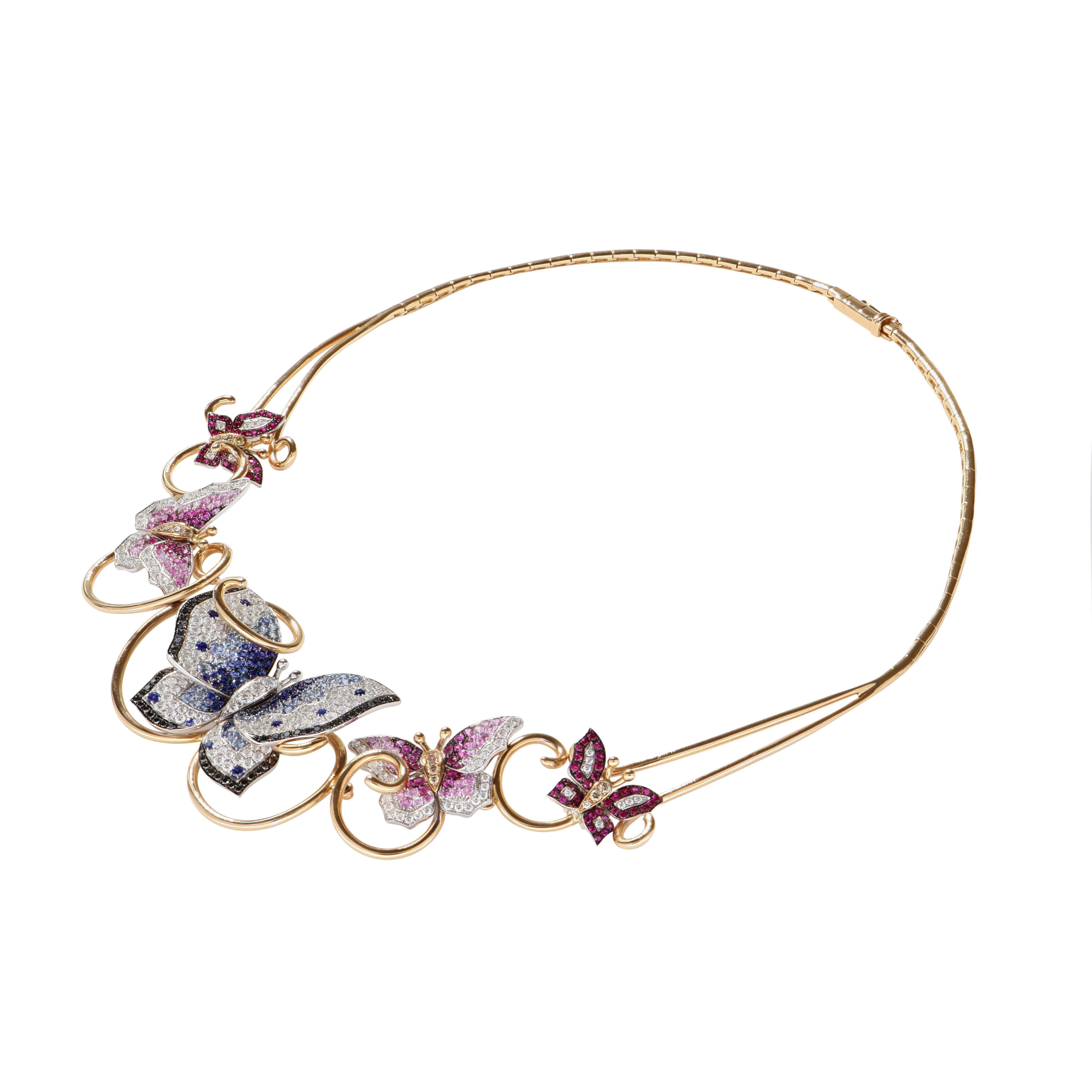 Crafted in 18 Kt yellow gold, this beautiful necklace features 5 glistering butterflies, all covered in different-shade rubies, sapphires, and diamonds. Perfect for special occasions, like cocktail parties, weddings, and any events where you want to