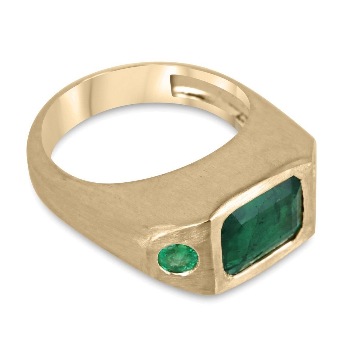 This gorgeous all-emerald three-stone ring is a true statement piece. The center of the ring boasts a stunning 3-carat natural emerald cut emerald from Zambia. On either side of the center stone, there are two smaller round-cut emeralds that