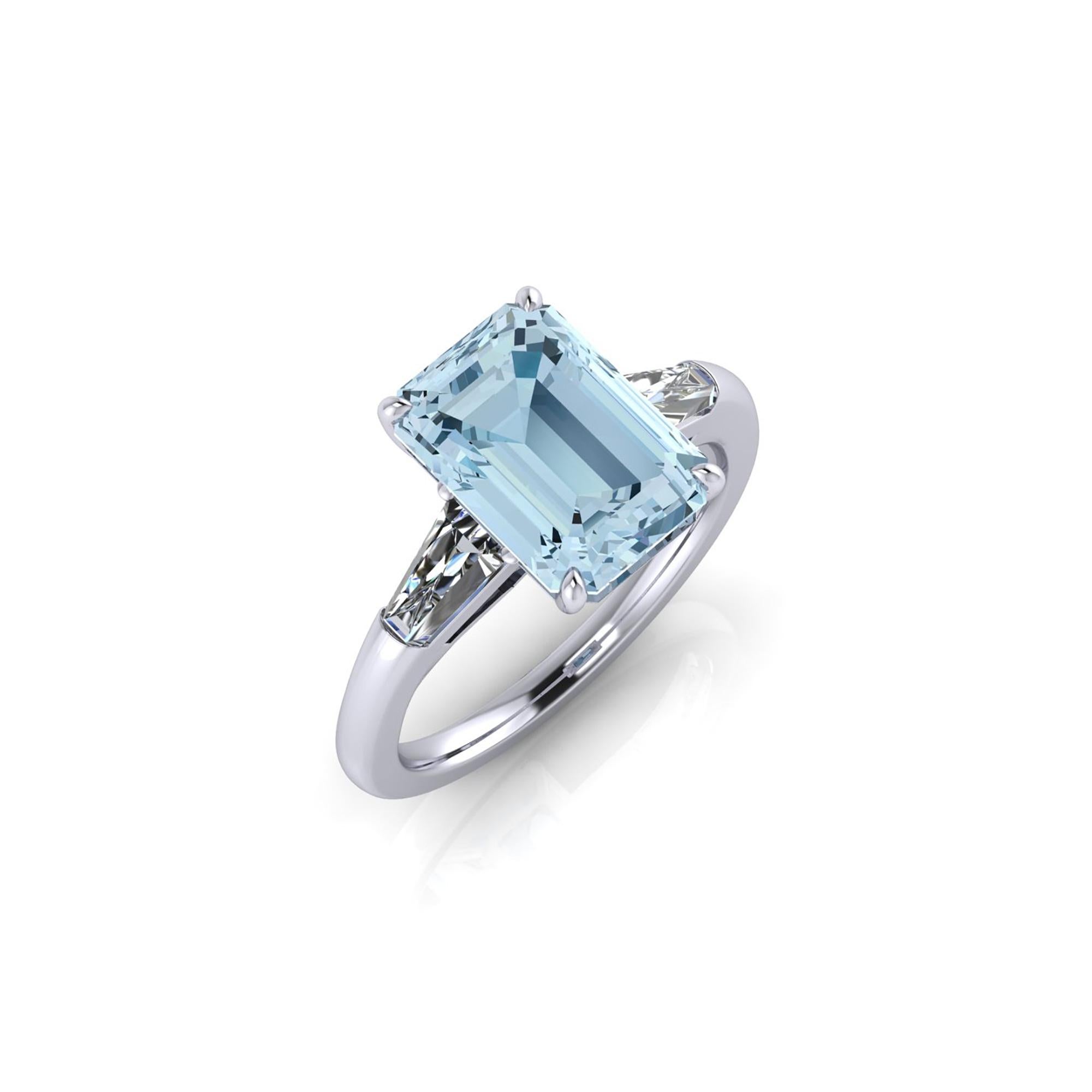 An exquisite 3.43 carat aquamarine, emerald cut accompanied two, tapered baguette, 0.42 carat total diamonds, G color, Vs clarity, 
set in an hand crafted, delicate and sophisticated looking platinum ring, manufactured with the best Italian