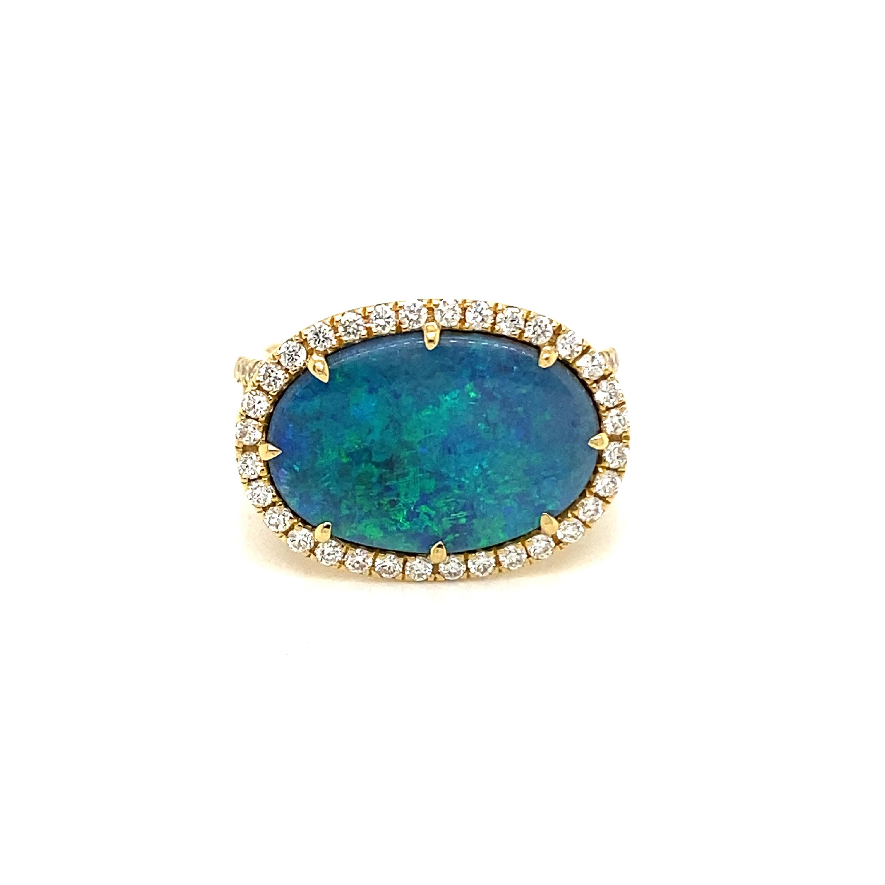 This stunning cocktail ring showcases a beautiful 3.43 Carat Lightning Ridge Oval Black Opal with a Diamond Halo on a Double Diamond Shank. This ring is set in 18K Yellow Gold, with 18K Yellow Hold prongs on the center stone.
Total Diamond Weight =
