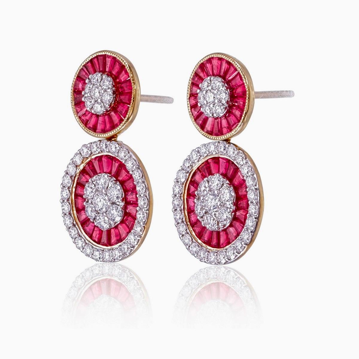 Introducing a pair of earrings featuring a 3.43 carat No Heat Burma Pigeon Blood ruby, renowned for its rich color and rarity.

Surrounding the center ruby are 1.89 carats of diamonds, enhancing the overall design.

Crafted in 18k gold, these