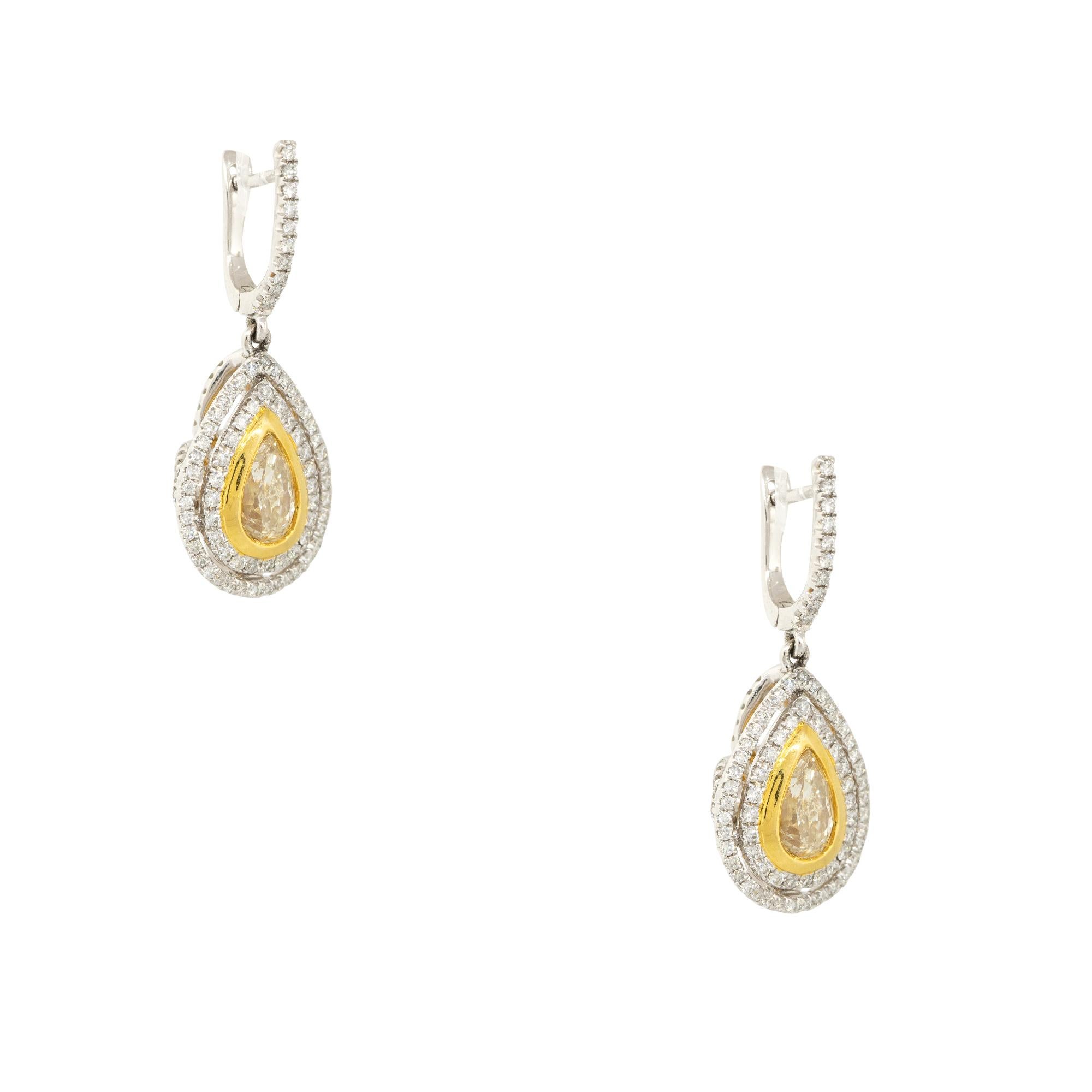 18k White and Yellow Gold 3.43ctw Pear Shaped Yellow Diamond Drop Earrings
Material: 18k White and Yellow Gold
Diamond Details: Approximately 2.23ctw of Pear shaped Yellow Diamonds. There are 2 Yellow Diamonds total and both are bezel