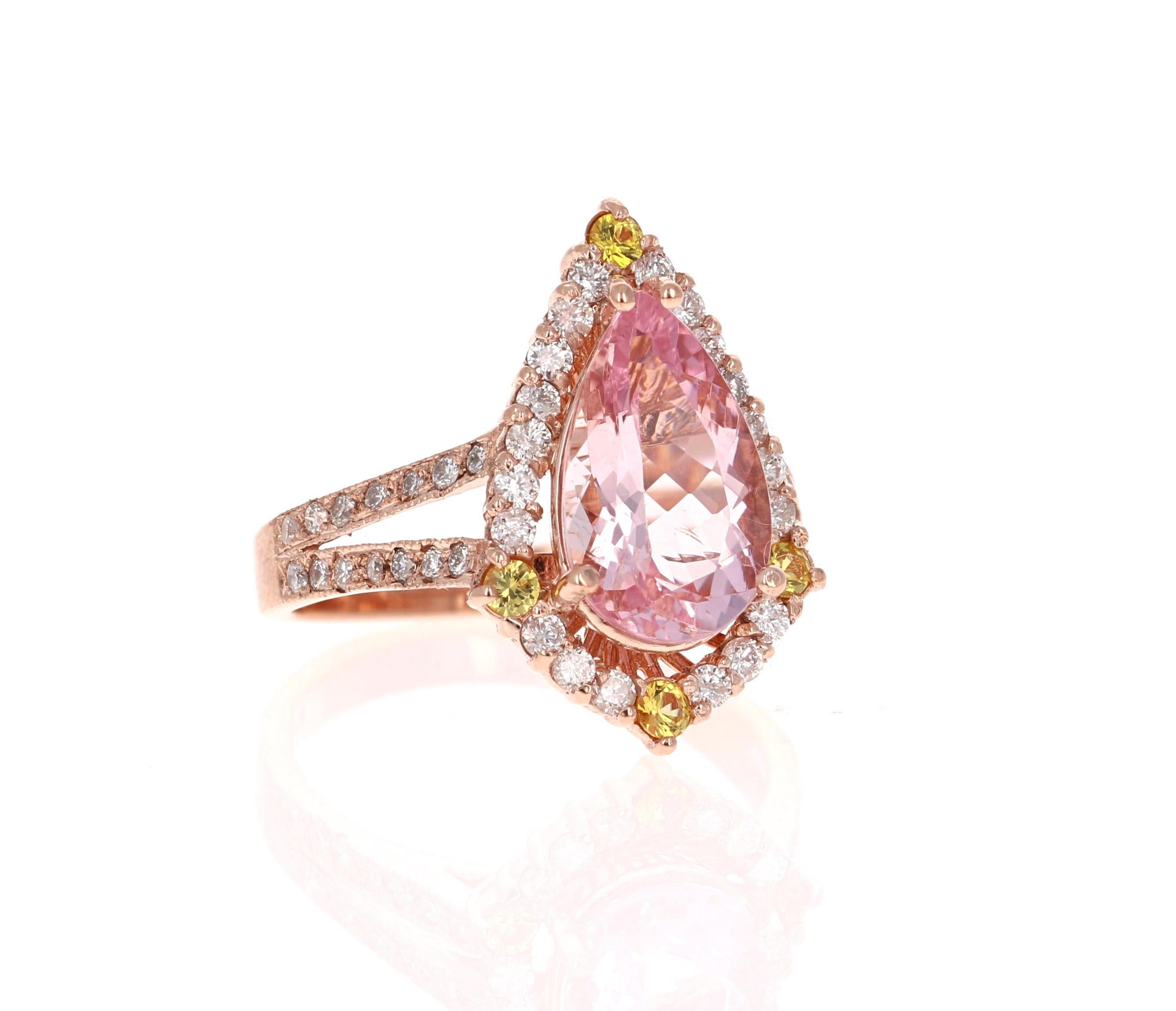 A lovely Engagement Ring Option or as an alternate to a Pink Diamond Ring! 

This gorgeous and classy Morganite, Yellow Sapphire and Diamond Ring has a 2.59 Carat Pear Cut Pink Morganite and has 48 Round Cut Diamonds that weigh 0.65 Carats (Clarity: