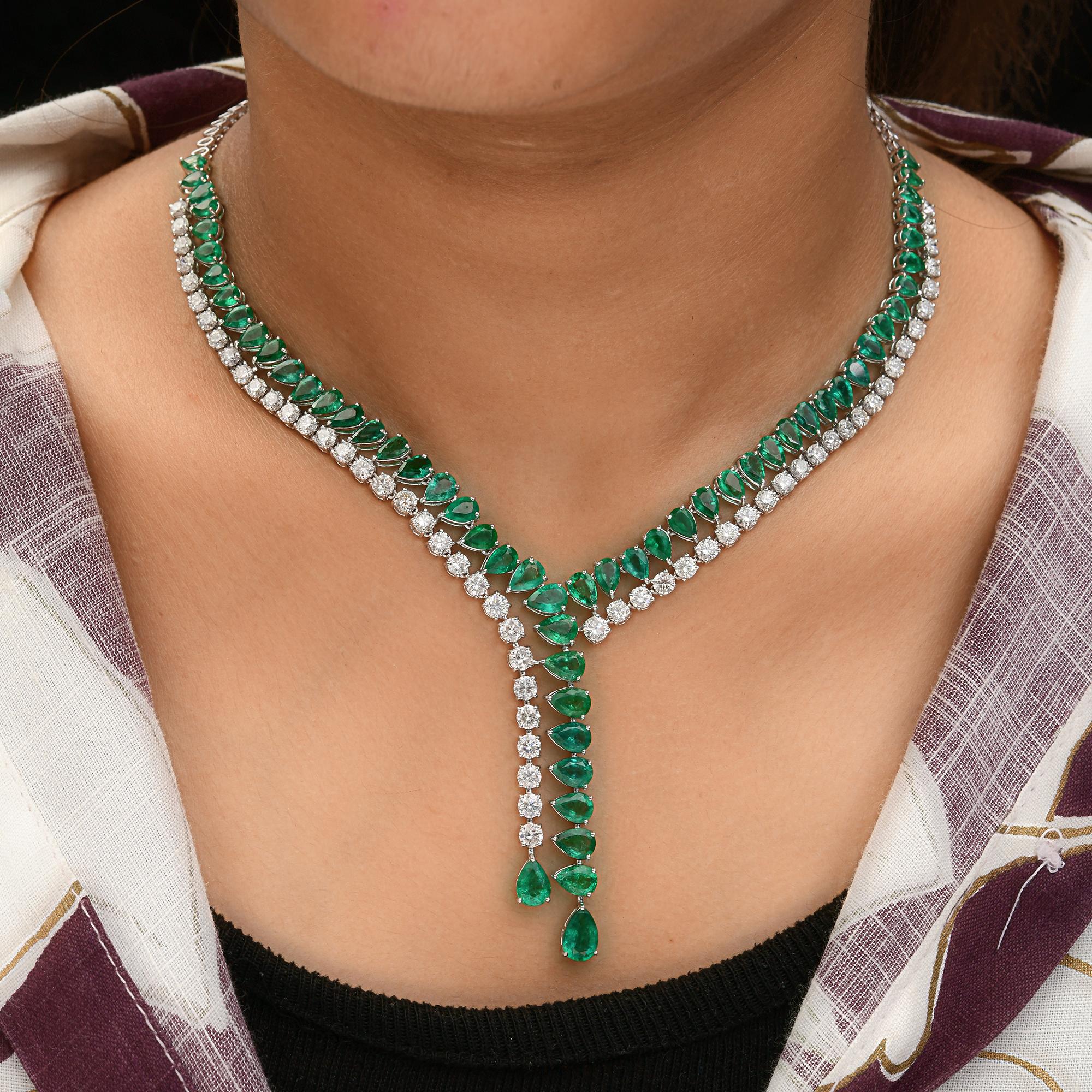 Indulge in opulence with this breathtaking 34.38 Total Carat Weight (TCW) necklace, a masterpiece of fine jewelry that seamlessly blends the vivid beauty of Zambian emeralds with the dazzling brilliance of natural diamonds. A luxurious necklace