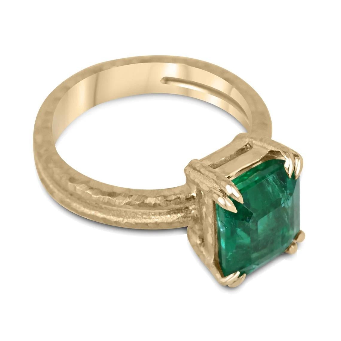 This exquisite solitaire ring features a natural 3.43-carat emerald cut emerald that boasts a stunning, vivid dark green color with excellent-very good luster that captivates the beholder. The emerald is set in a double claw prong basket, which is