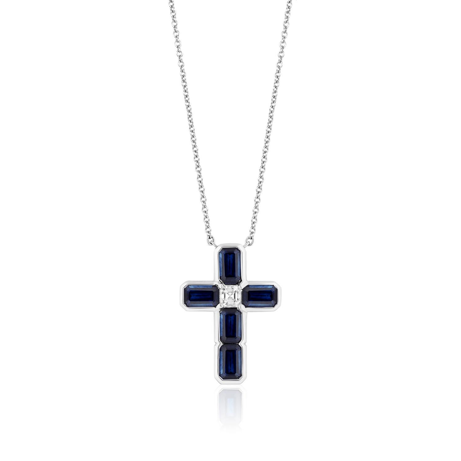 Emerald Cut Sapphires and White Asscher Cut Diamond set in this beautiful and bold Cross.
5 Emerald Cut Sapphires weighing 3.24 Carats. 1 Diamond Weighing 0.20 Carats.
Set in Platinum
Chain measures 16 inches. Can be lengthened. 