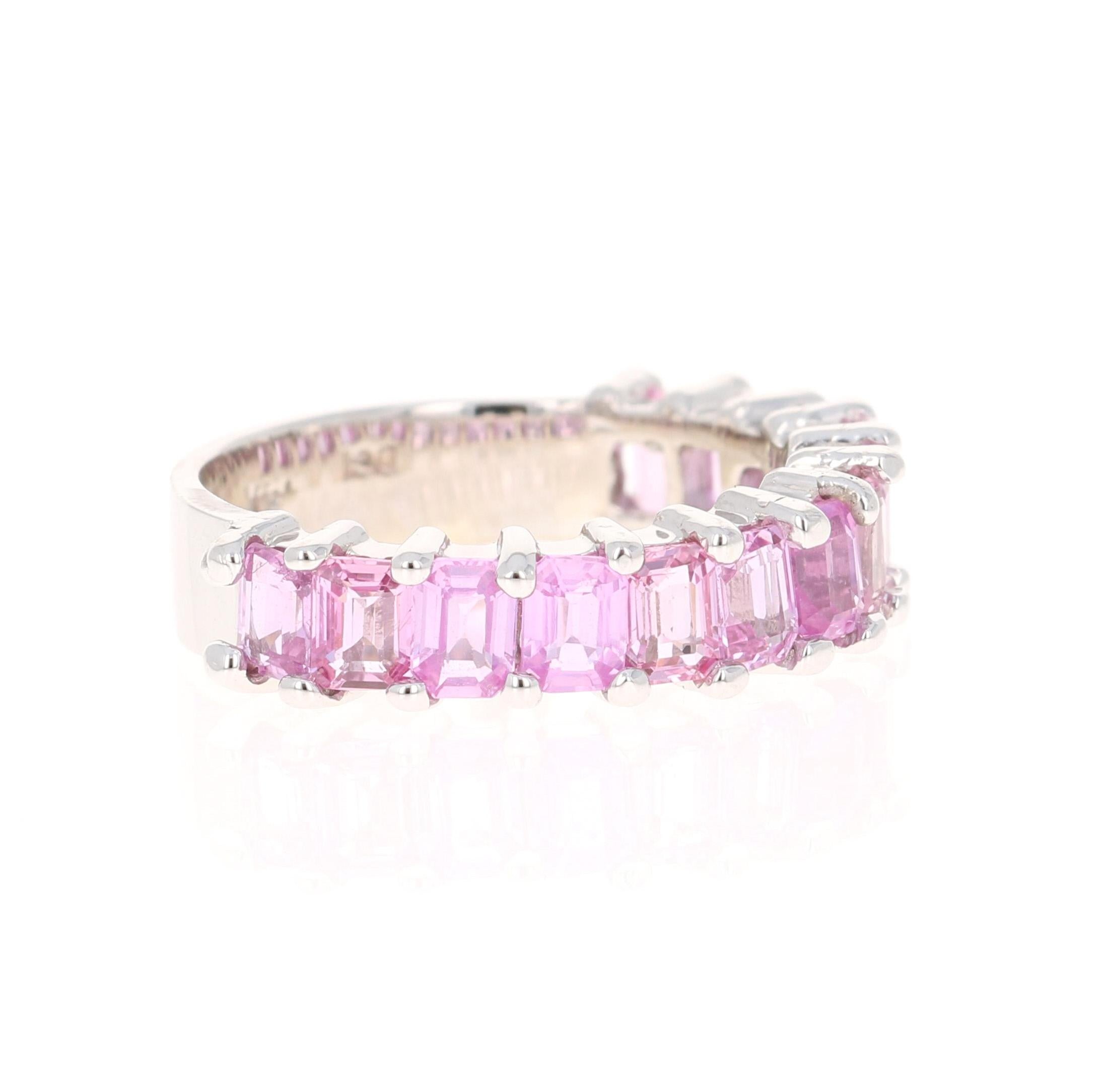 This ring has 13 Emerald Cut Pink Sapphires that weighs 3.44 Carats. 

Crafted in 18 Karat White Gold and weighs approximately 4.8 grams 

The ring is a size 7 and can be re-sized at no additional charge