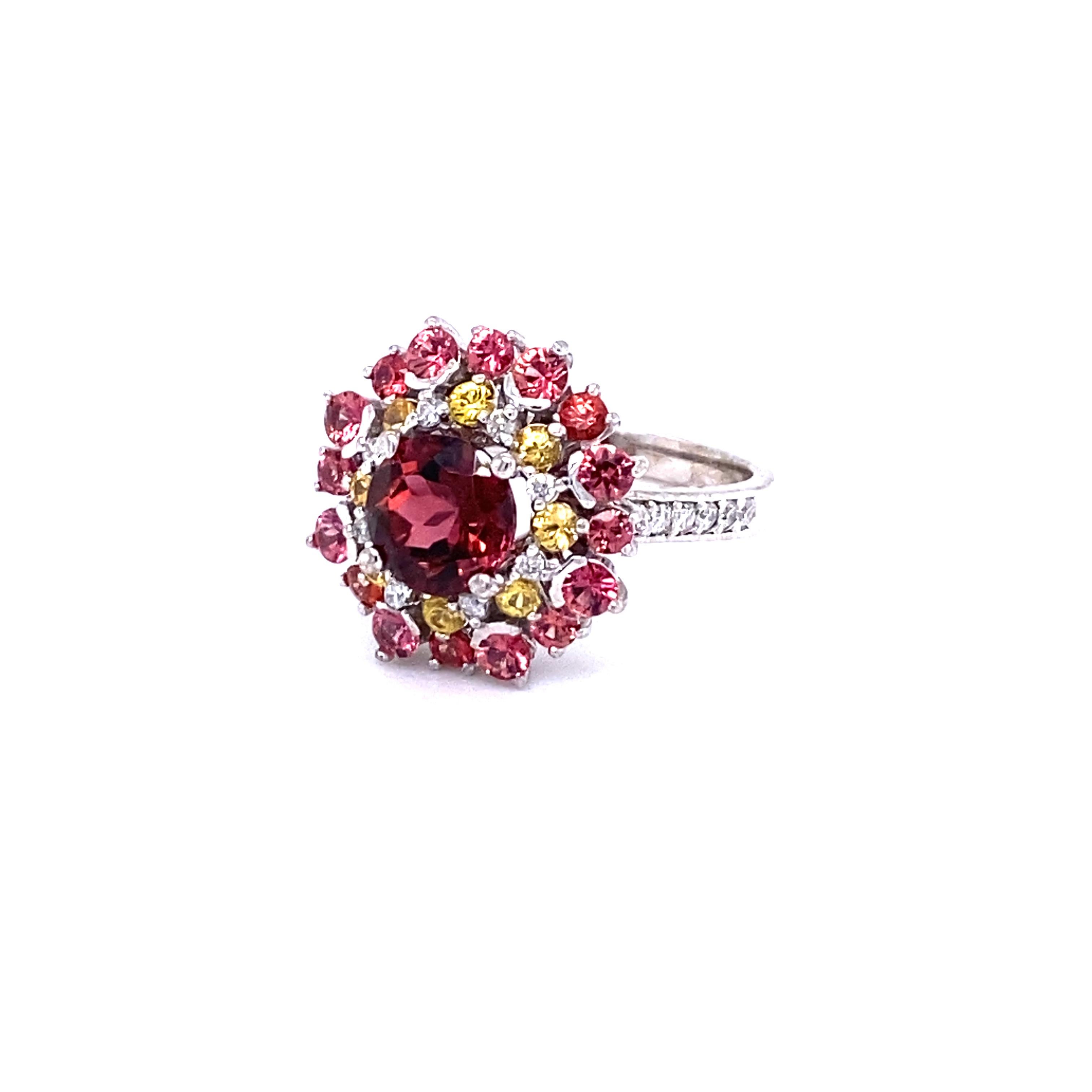 Stunning and uniquely designed 3.44 Carat Tourmaline, Red and Yellow Sapphire and Diamond White Gold Cocktail Ring! 

This ring has a 1.78 Carat Round Cut Tourmaline and is surrounded by 24 Round Cut Yellow and Red Sapphires that weigh 1.41 Carats