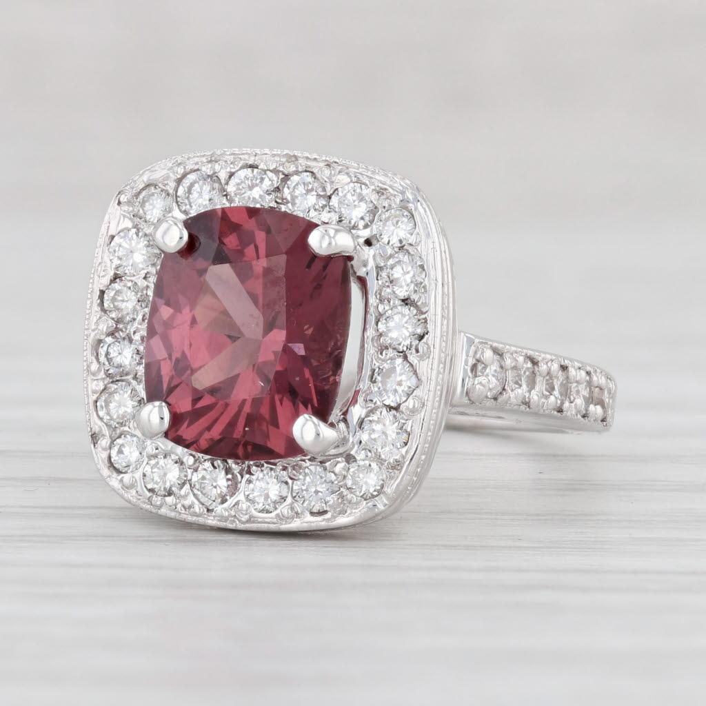 Gemstone Information:
*Natural Burma Spinel*
Carats - 2.84ct
Cut - Cushion Brilliant 
Color - Maroon Red

*Natural Diamonds*
Total Carats - 0.60ctw
Cut - Round Brilliant
Color - F - H
Clarity - SI1 - SI2

Metal: 14k White Gold
Weight: 8.9 Grams
