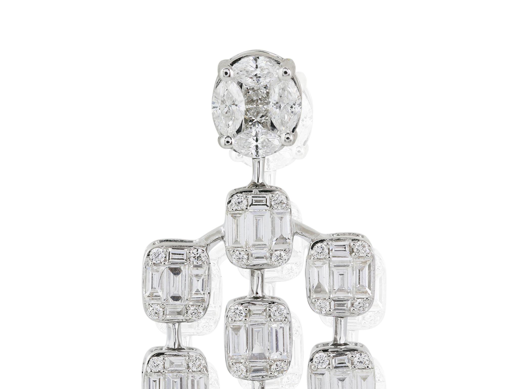 Stunning 18 karat white gold diamond chandelier earrings consisting of round brilliant cut, pear, marquise, and emerald cut diamonds having a total weight of 3.45 carats with a clarity of G VS2 respectively.