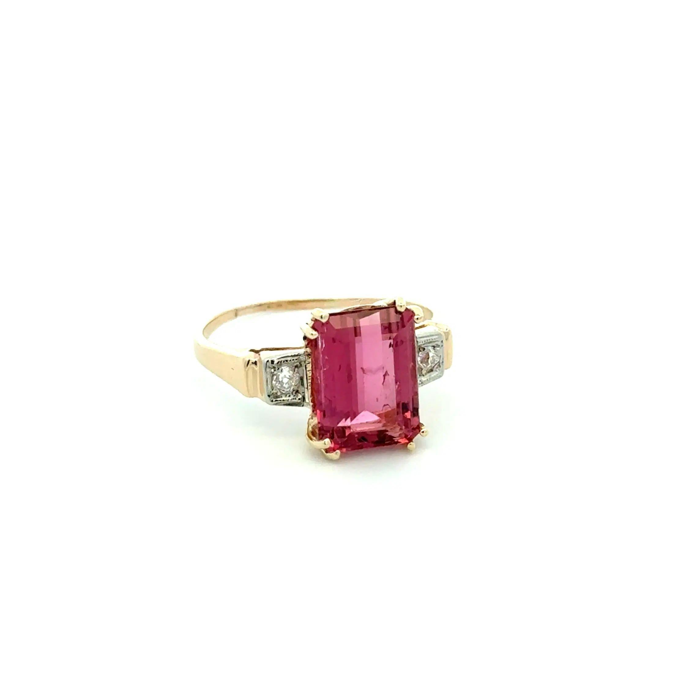 Simply Beautiful! Finely Detailed Emerald Cut Rubelite Tourmaline and OEC Diamond Vintage Cocktail Ring. Centering a securely nestled Hand set Emerald-Cut Rubellite Tourmaline, weighing approx. 3.45 Carat. Enhanced with .08tcw Old European Cut