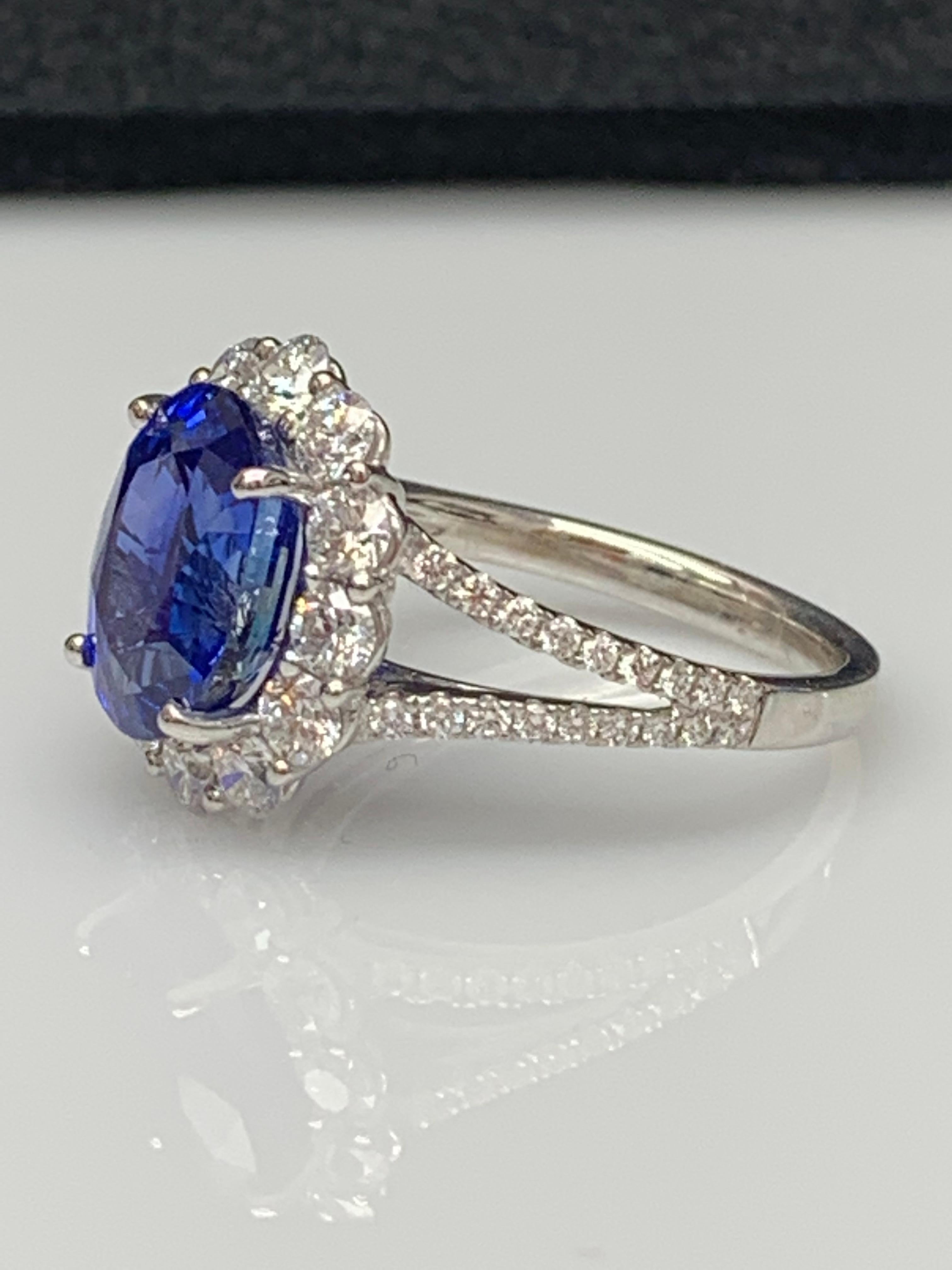 Contemporary 3.45 Carat Oval Shape Blue Sapphire and Diamond Flower Ring in 18K White Gold For Sale