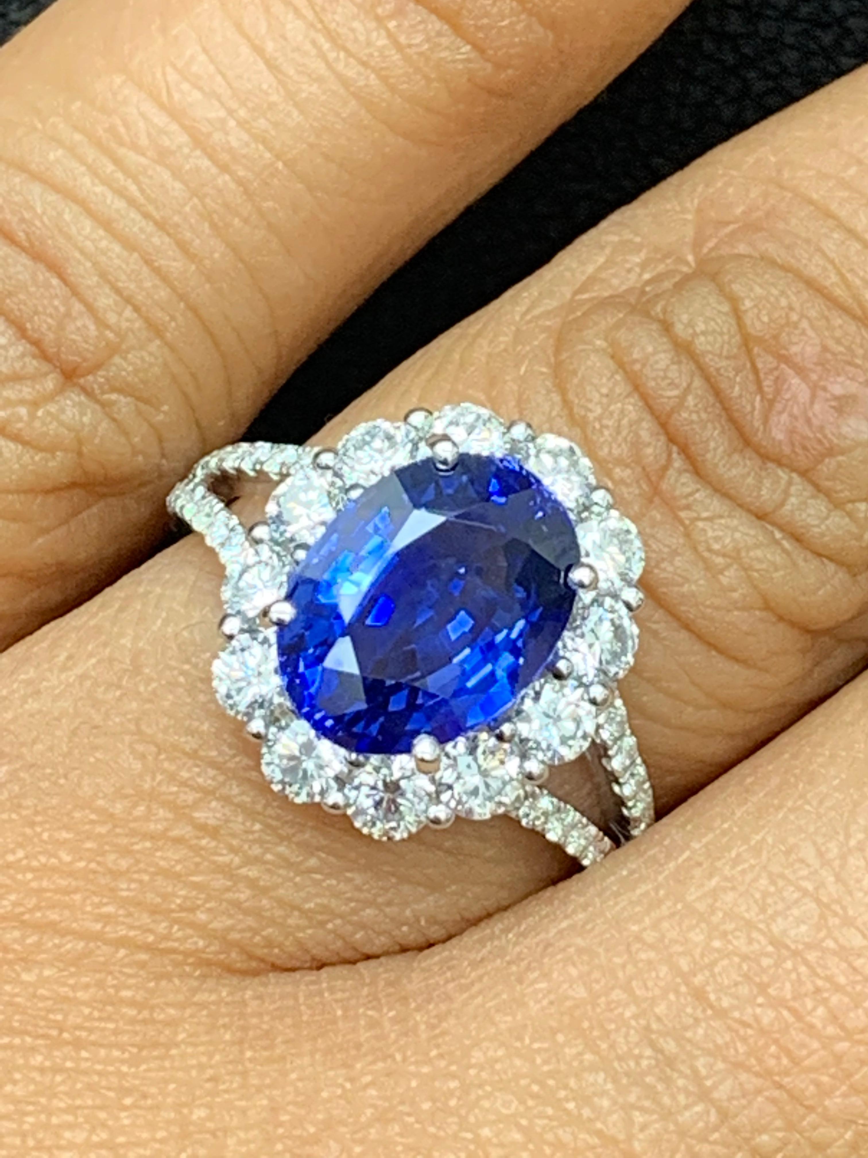 3.45 Carat Oval Shape Blue Sapphire and Diamond Flower Ring in 18K White Gold In New Condition For Sale In NEW YORK, NY