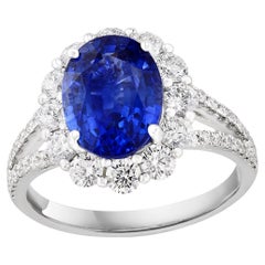 3.45 Carat Oval Shape Blue Sapphire and Diamond Flower Ring in 18K White Gold