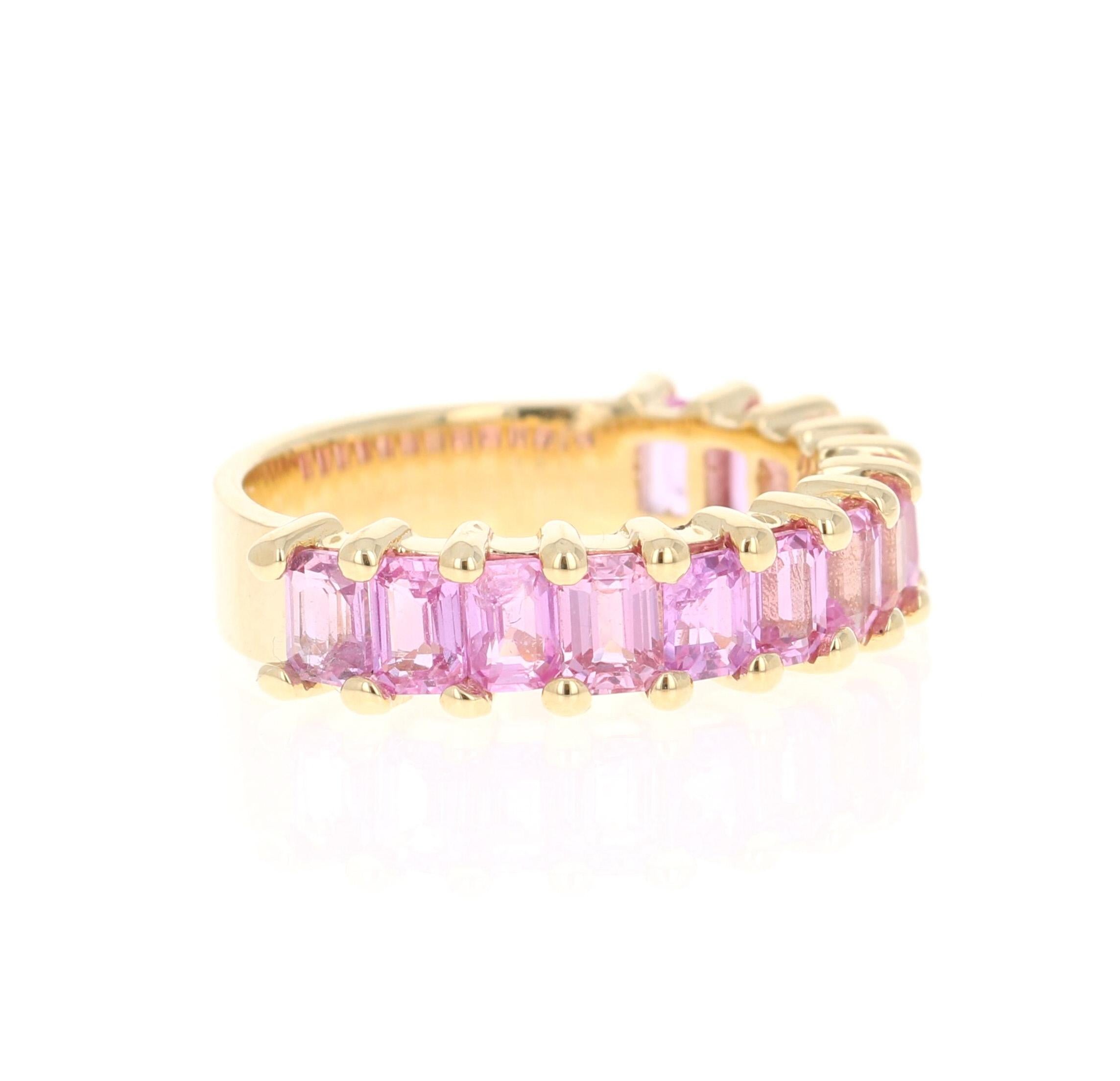 This ring has 13 Emerald Cut Pink Sapphires that weighs 3.45 Carats. 

Crafted in 18 Karat Yellow Gold and weighs approximately 5.0 grams 

The ring is a size 7 and can be re-sized at no additional charge